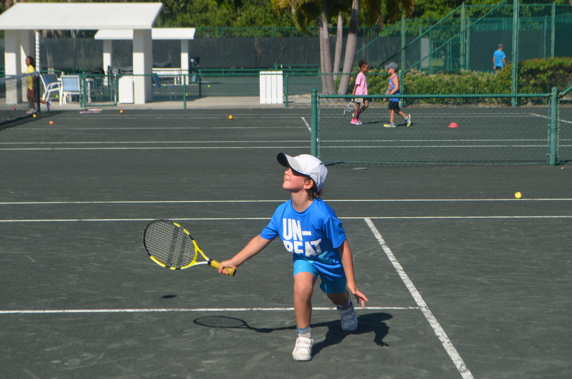Roman Tahar, on vacation from France, waits to hit the ball at last year's tennis camp.
