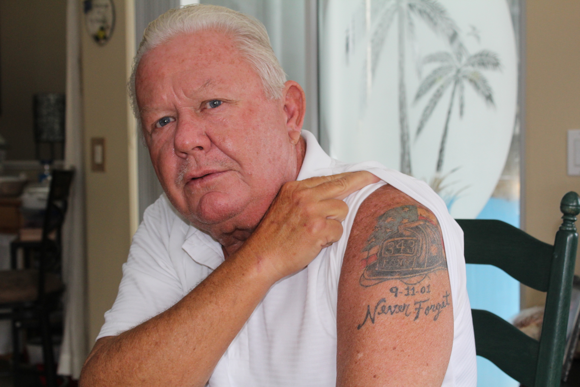 University Park's Gerard McParland shows his tattoo, his mark of remembrance for the 343 firefighters that lost their lives on 9/11.