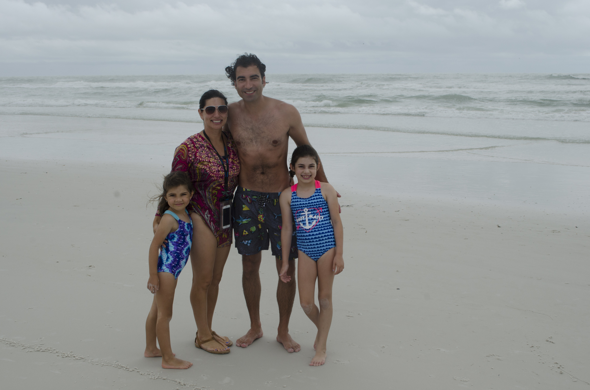 From left are Mirabel, Jessica, Joe and Isadora Apple. The family from South Carolina said they were making the best of the bad weather, even if they couldn't go too far in the water.