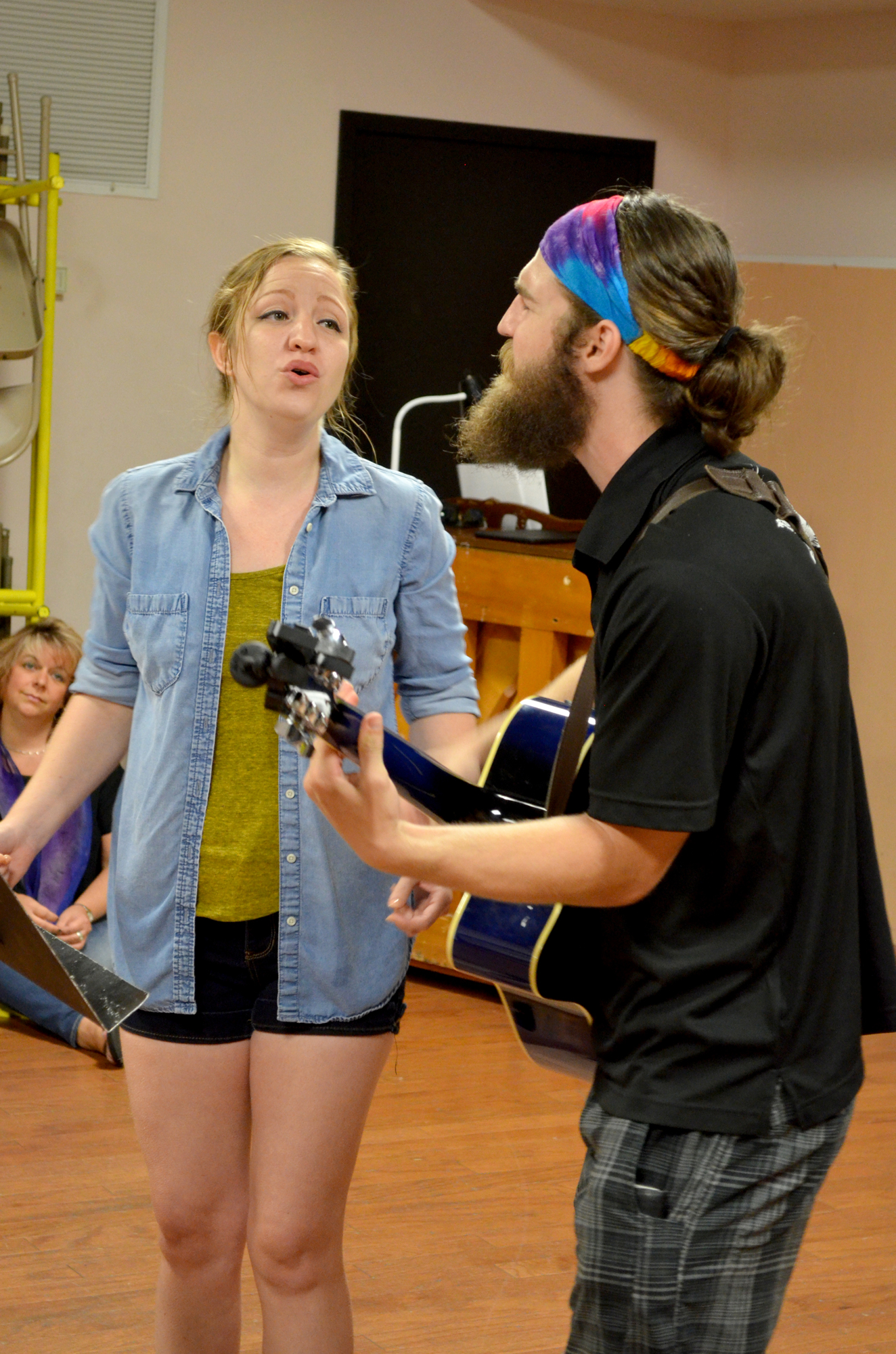Vera Samuels and Killam Tyler Johnson sing a duet at rehearsals for  Random Acts’ upcoming performance, “Hold My Beer.”