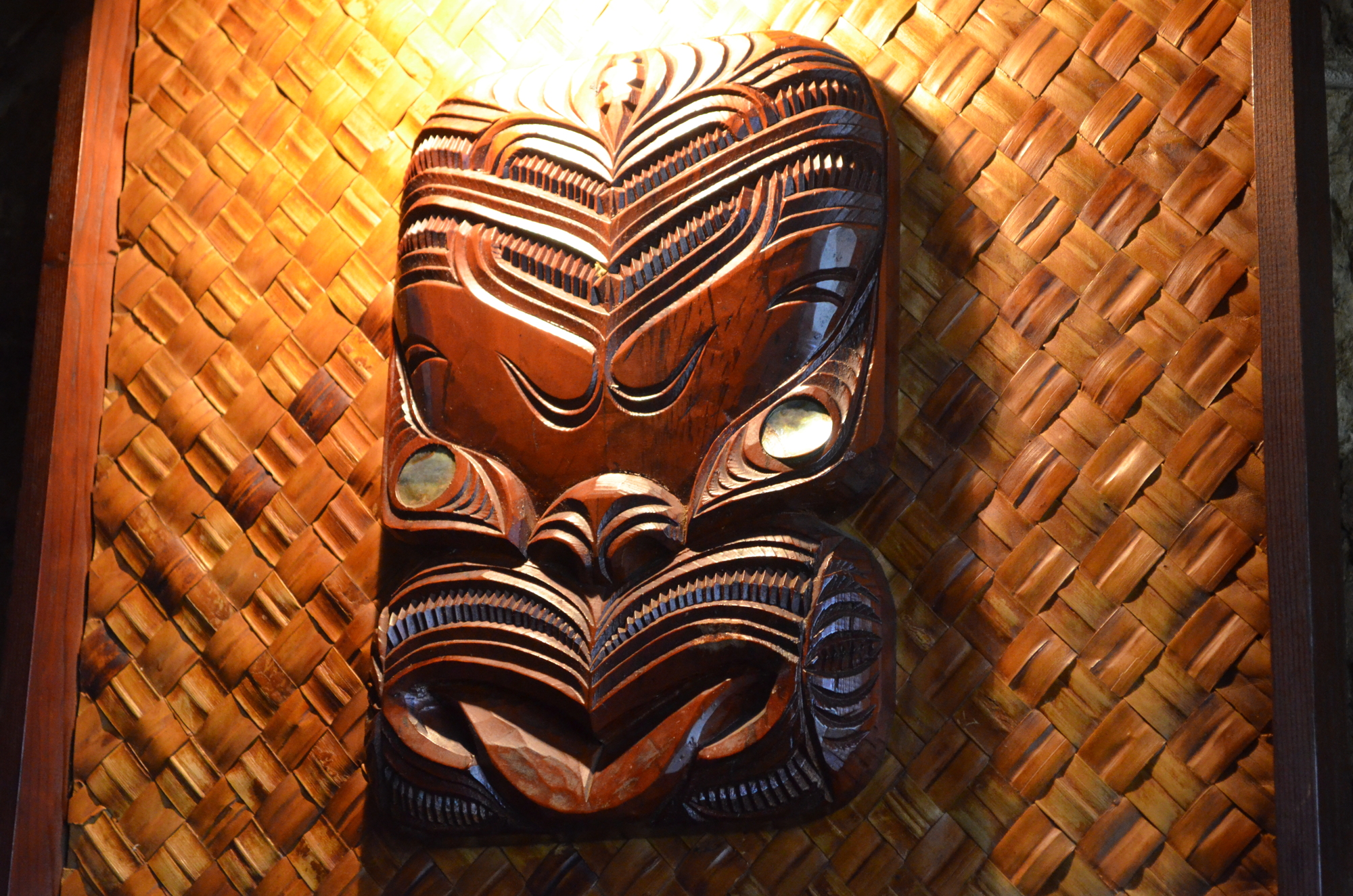To meet traditional tiki standards, carved masks are natural wood color, dark and more serious than their clownish counterparts. 