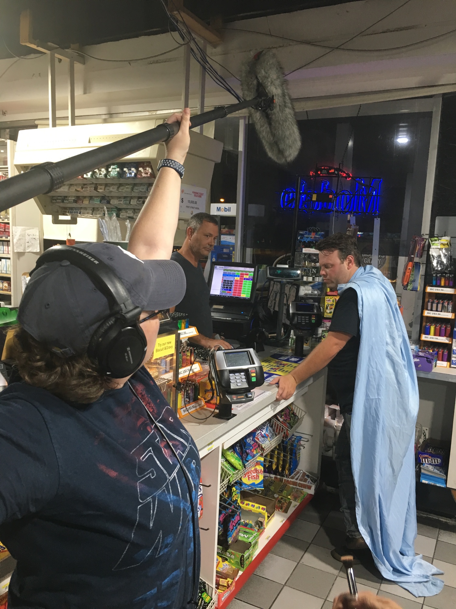 “Bedsheet Man,” played by co-director and producer David Leo Shultz, is about to save the day at a gas station.