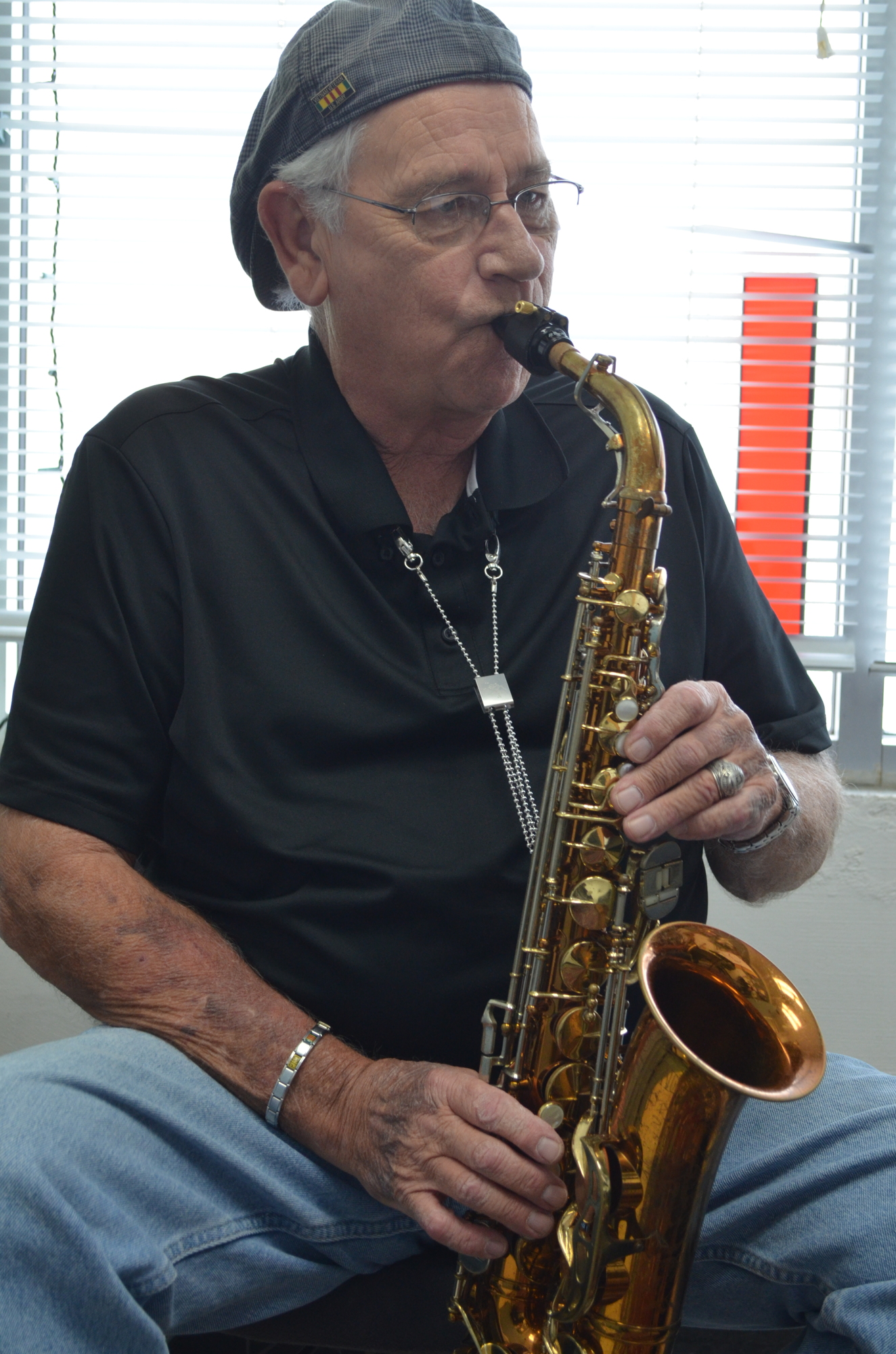 Bob Moffitt  plays along to a Miles Davis record during a lesson.