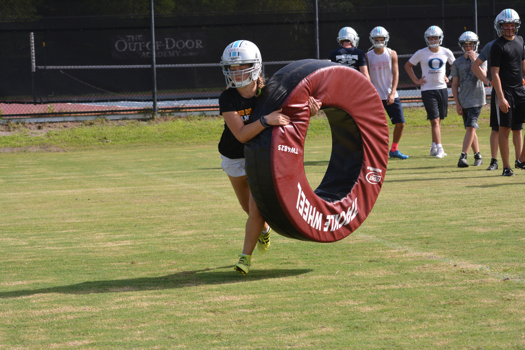 Christina Lutton practices her tackling at ODA training camp.