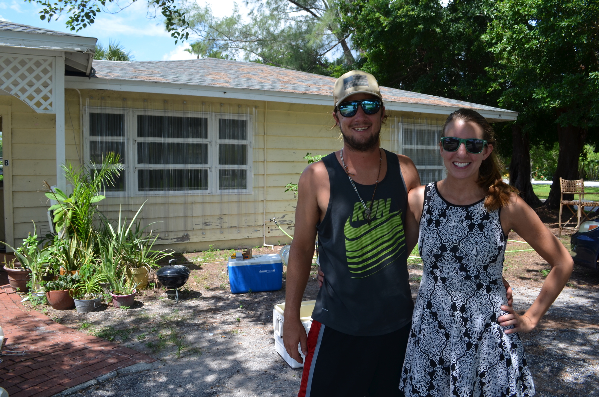 Will Bither and Briana Dobbs are working with their neighbors to stormproof their home before they leave Lido Key.