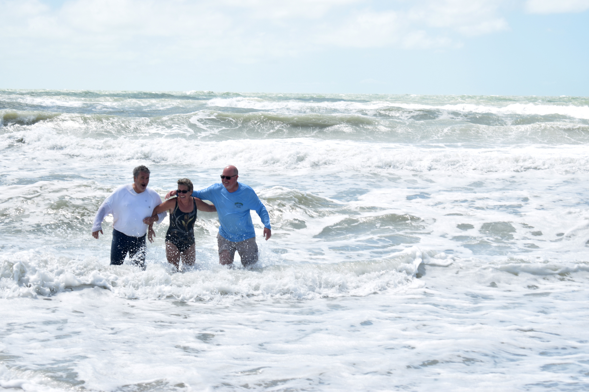 Fred Lugano, Carol Miller and Rudy Schippers test out the waters of the Gulf of Mexico on Longboat Key. The trio did not evacuate Longboat Key during Hurricane Irma. Photo by Katie Johns