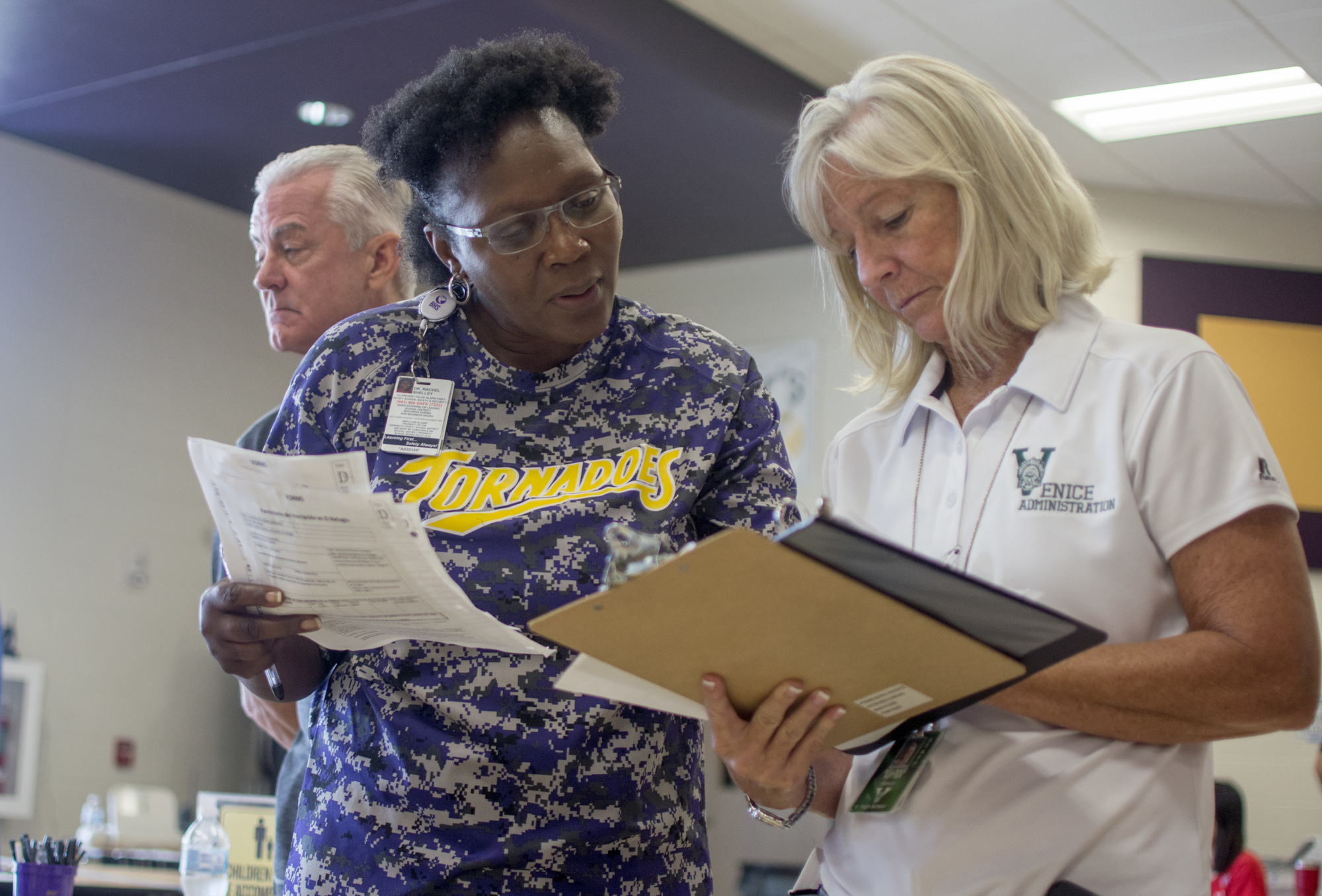 Booker High School Principal Rachel Shelley and Assistant Principal in charge of Administration at Venice High School Melanie Ritter look over paperwork at Booker High School on Saturday.  
