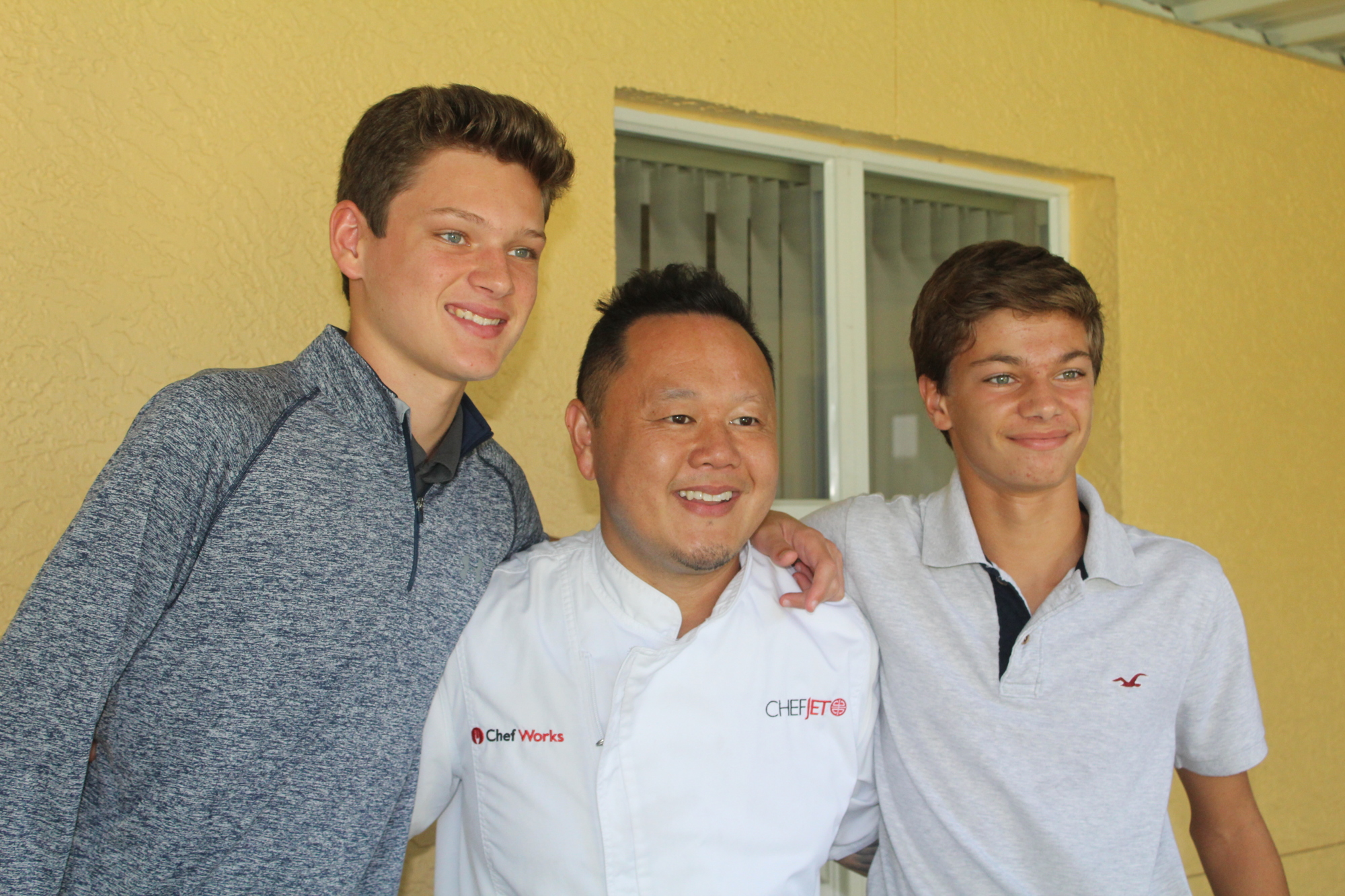 Out-of-Door Academy freshman Tyler O'donoghue, Chef Jet Tila and freshman Hayden Bizick get acquainted.