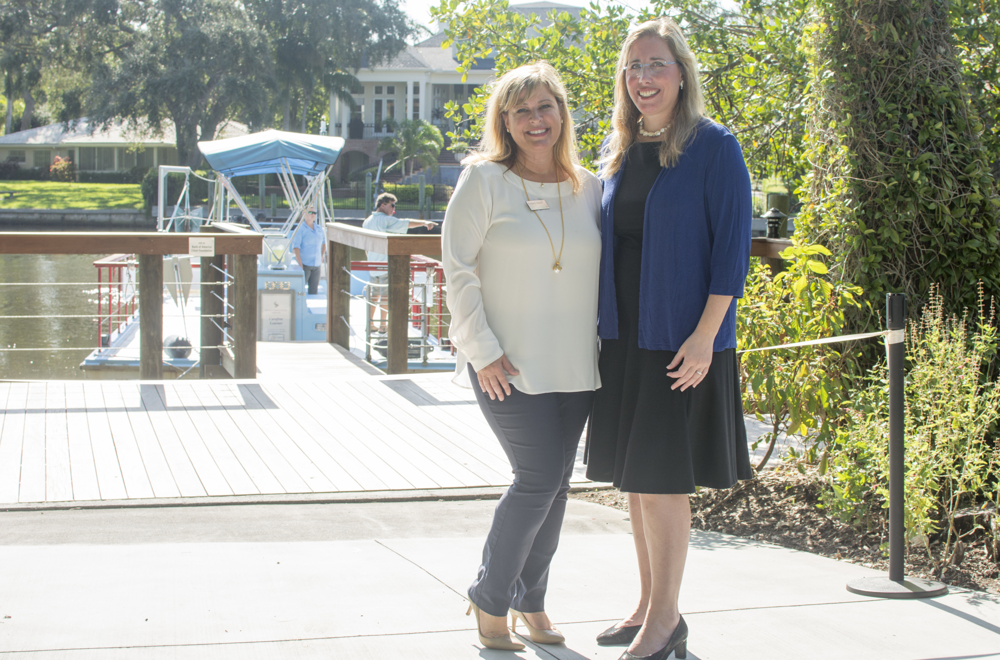 Kimberly Bleach of Bank of America Client Foundation poses with Selby President and CEO Jennifer Rominiecki in front of the newly improved dock.