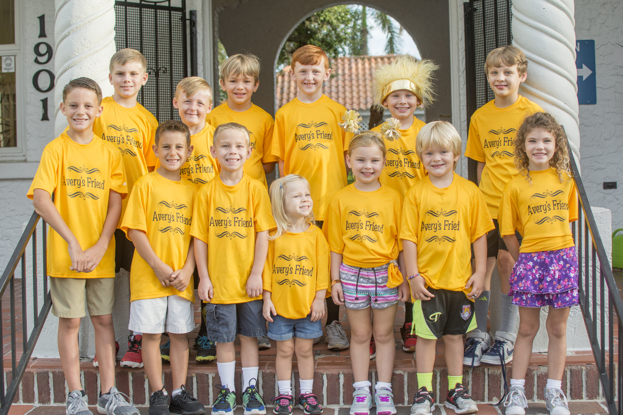 Children from the Southgate neighborhood pose with their matching shirts in honor of fellow student Avery Rann.