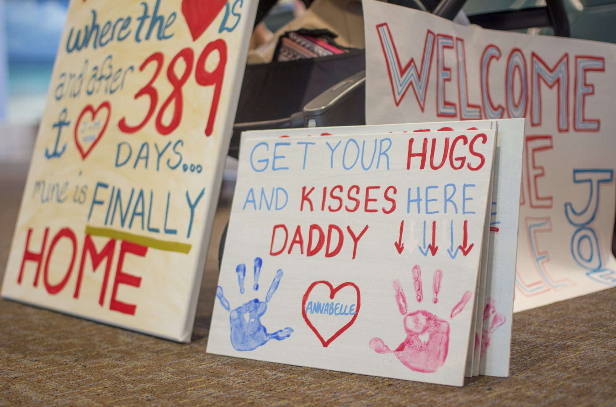 Family and friends gathered at Sarasota-Bradenton International Airport armed with signs welcoming Commander Joe Hembree home.