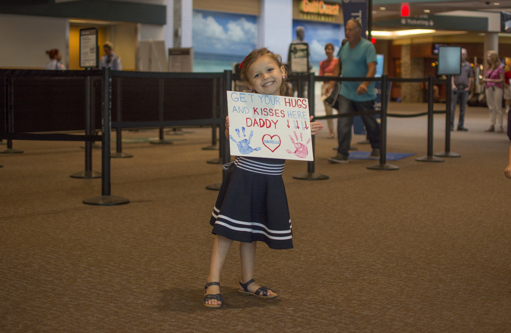 Annabelle Hembree poses with her welcome sign.