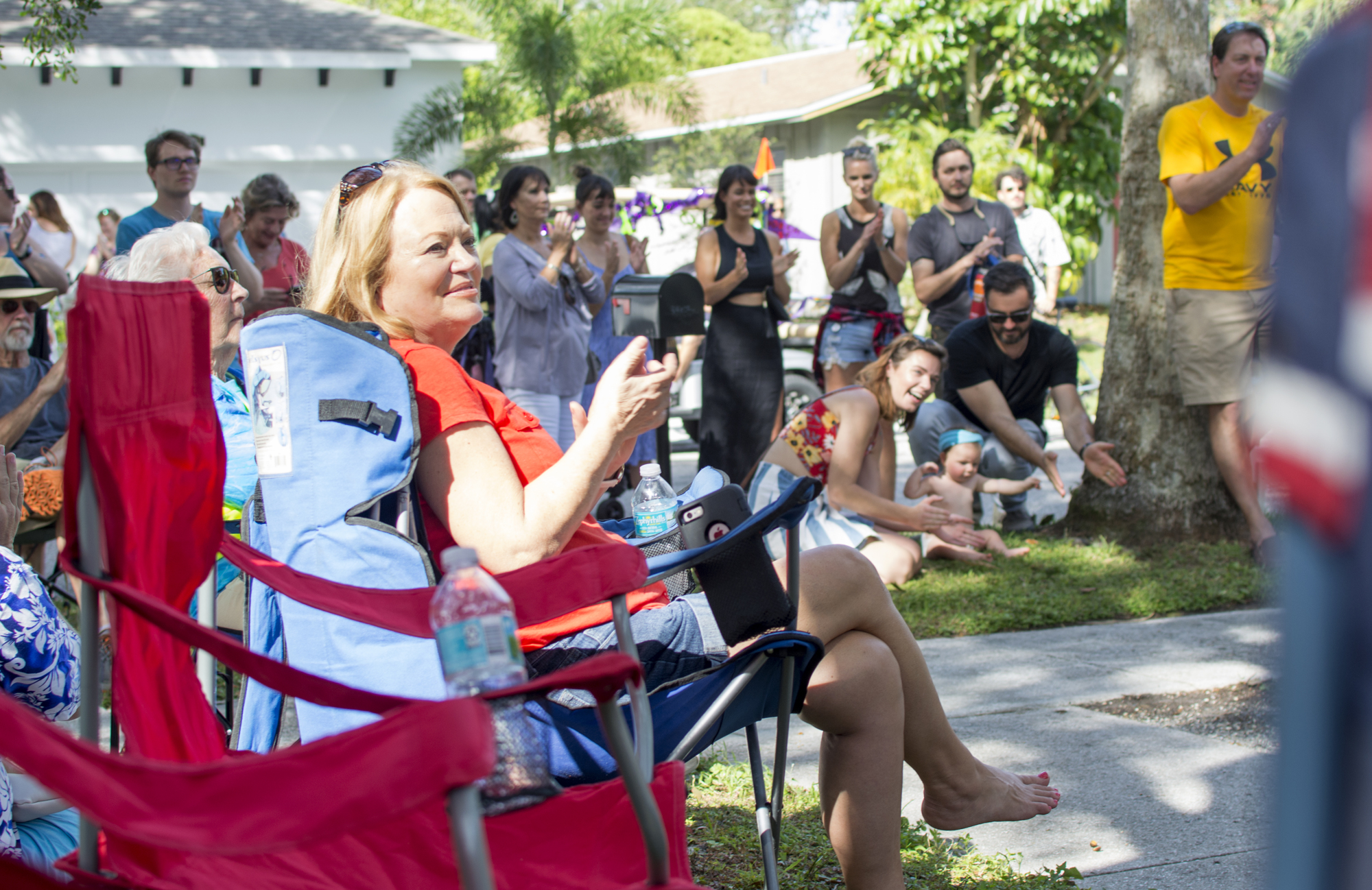 Linda Hartman applauds after a performance during the second annual Arlington Park Porchfest.