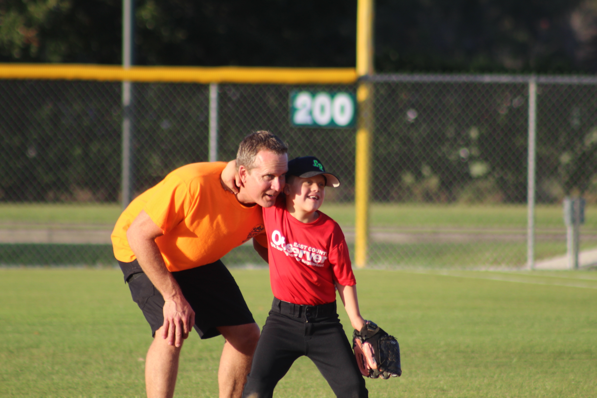 GreyHawk Landing’s Randy and Cameron Cody share a hug before Cameron’s Little League game in Lakewood Ranch.