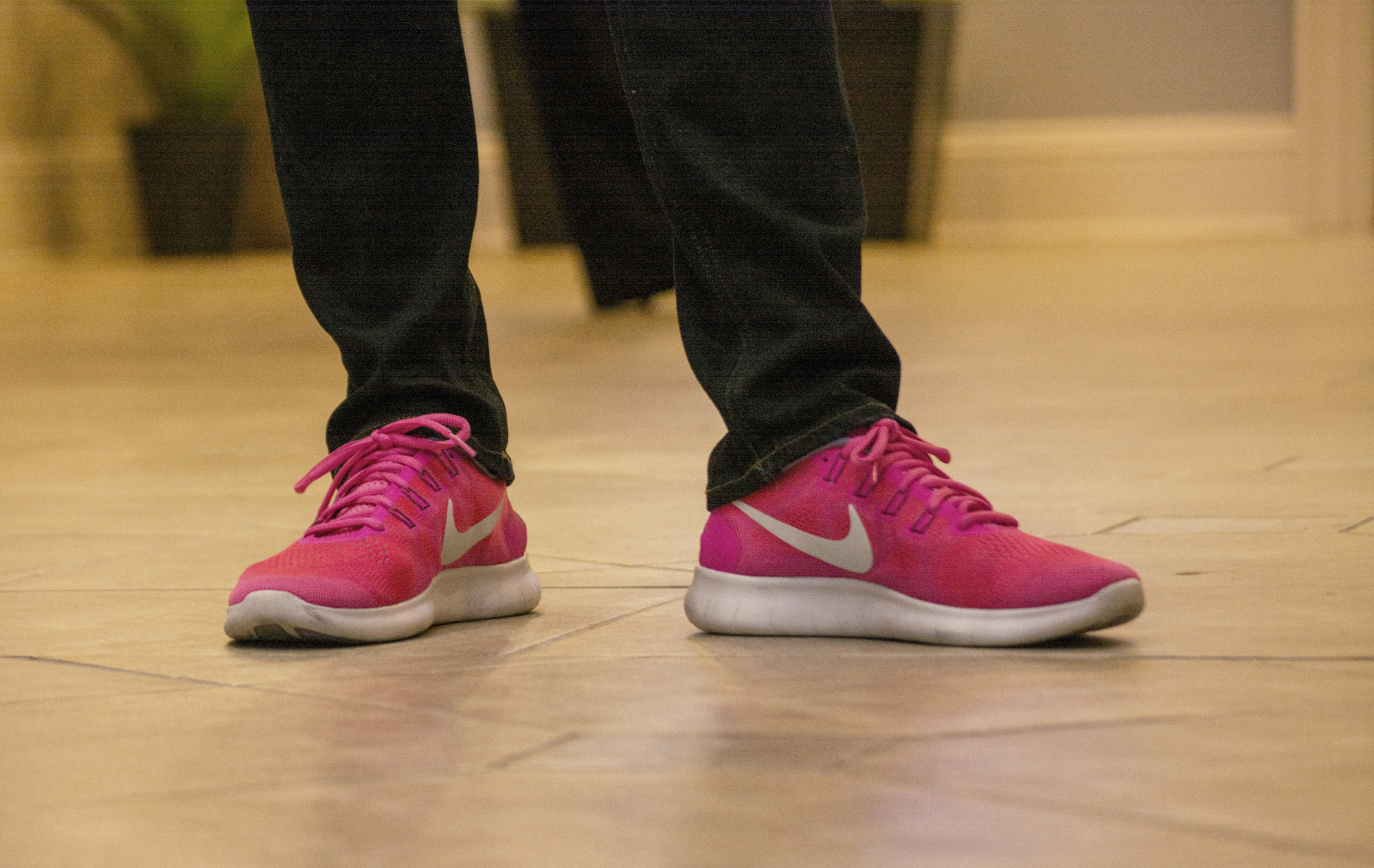 Anne Patterson wears a pair of bright pink Nike's during the unveiling of her latest piece entitled 