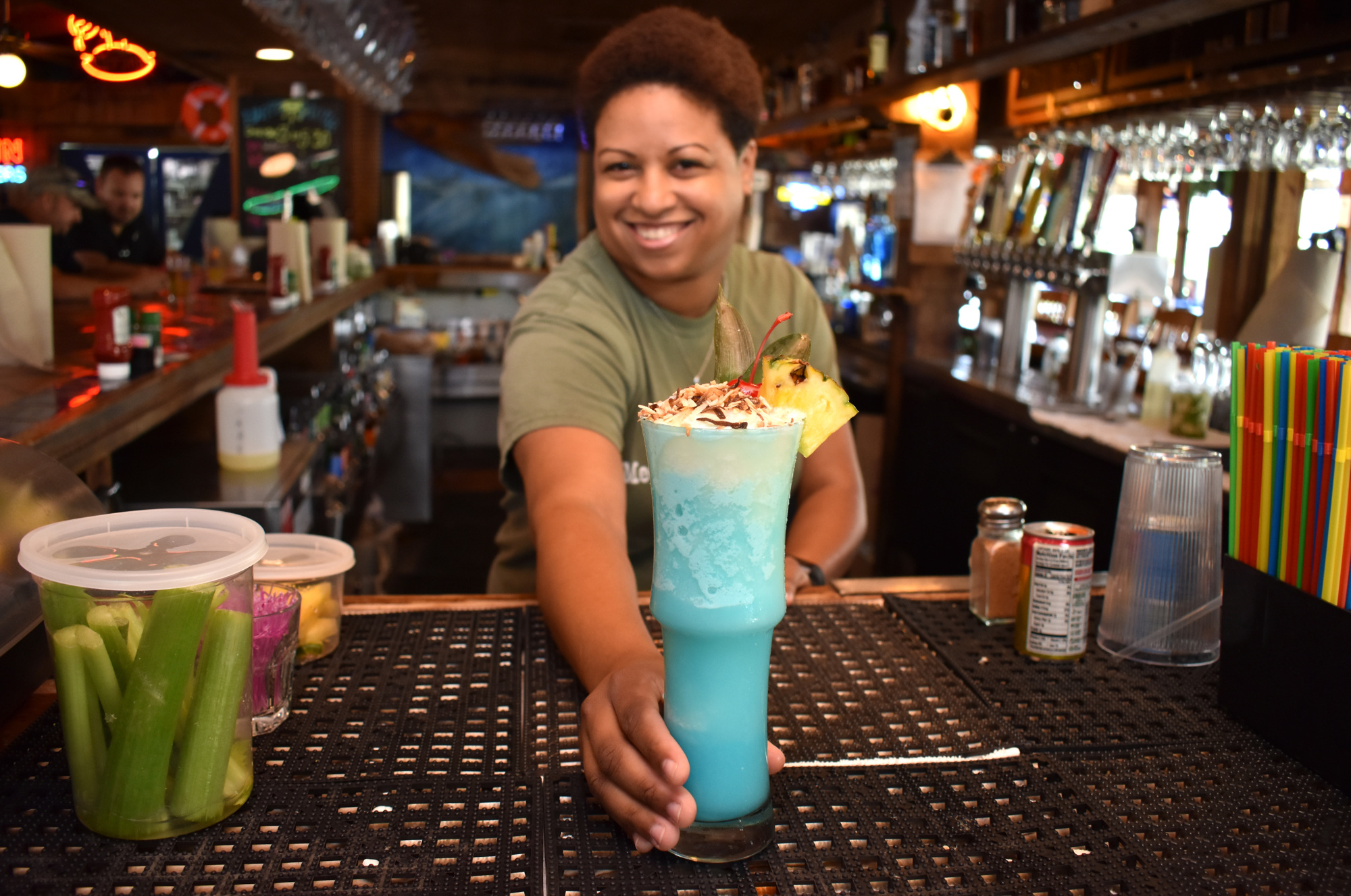 Phillippi Creek Village Restaurant & Oyster Bar's veteran bartender Jasmine Stanco serves a Caribbean Coolada. Photo by Niki Kottmann.