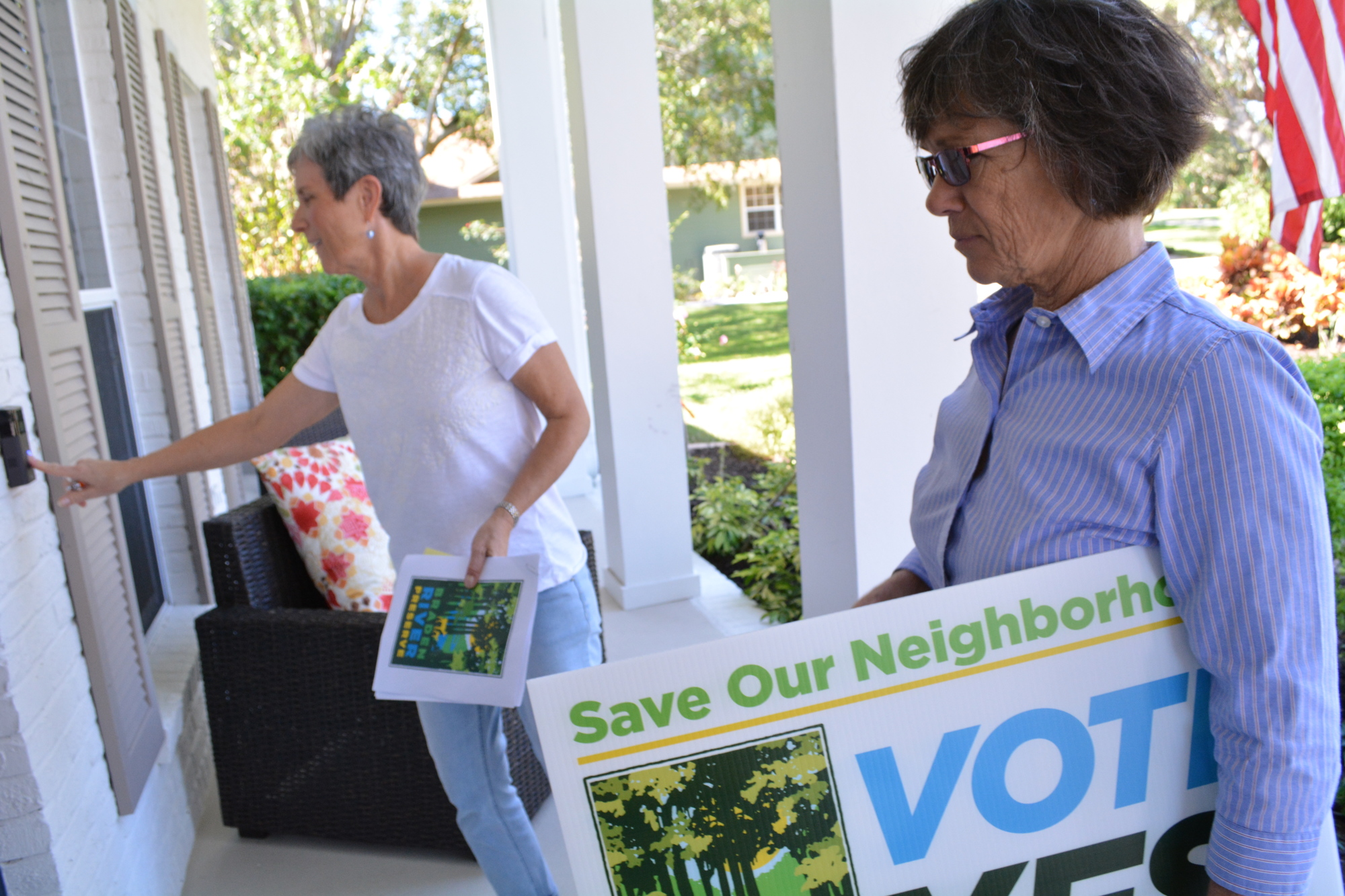 Peggy Klimek rings the door of a neighbor in River Club as she and Cheryl Atkinson go door to door to educate neighbors about the proposed Municipal Service Taxing Unit and how it could fund the creation of Braden River Preserve.