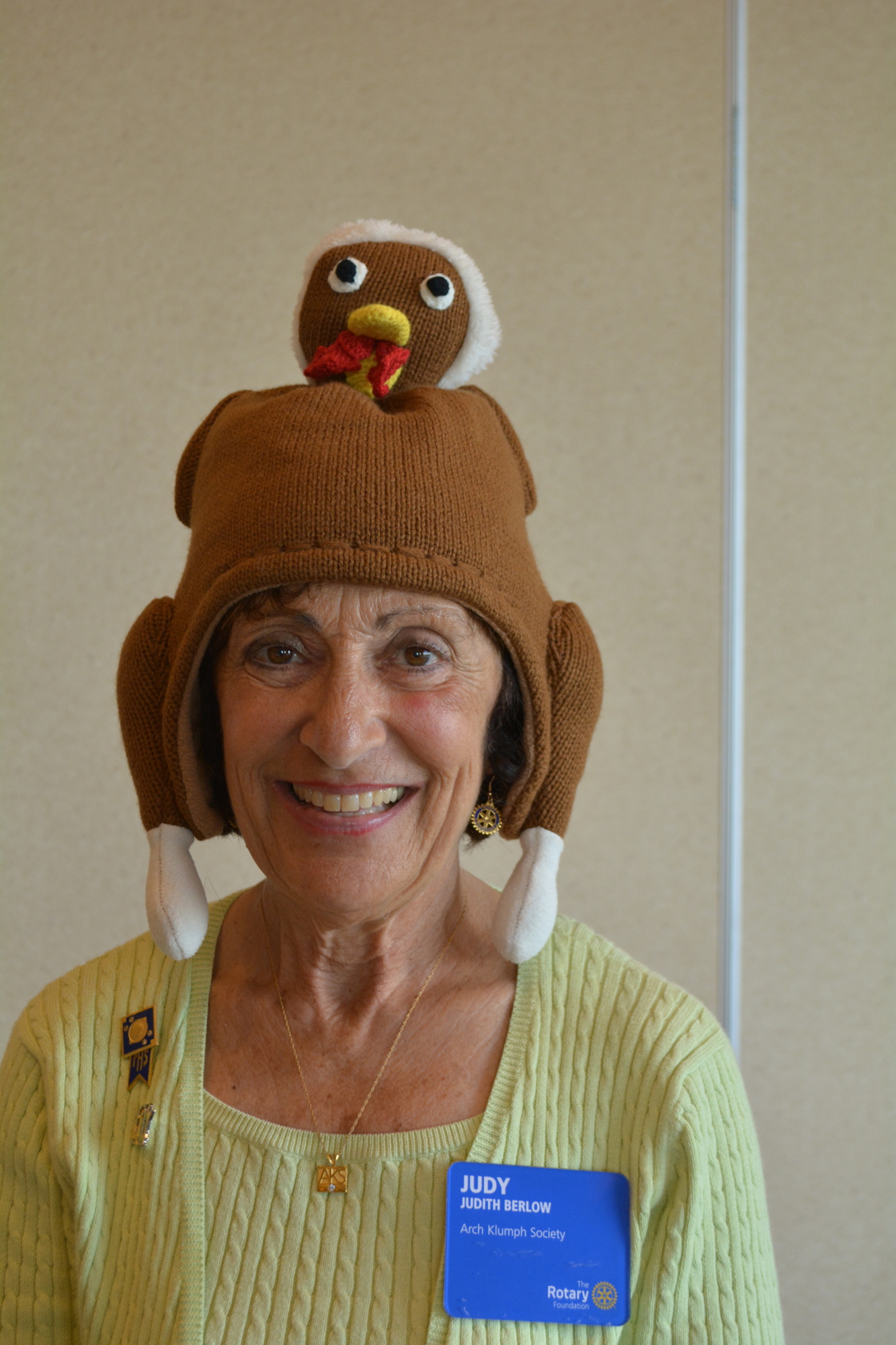 Rotary Club of Lakewood Ranch's Judy Berlow takes her turn wearing a turkey hat. Photo by Pam Eubanks.