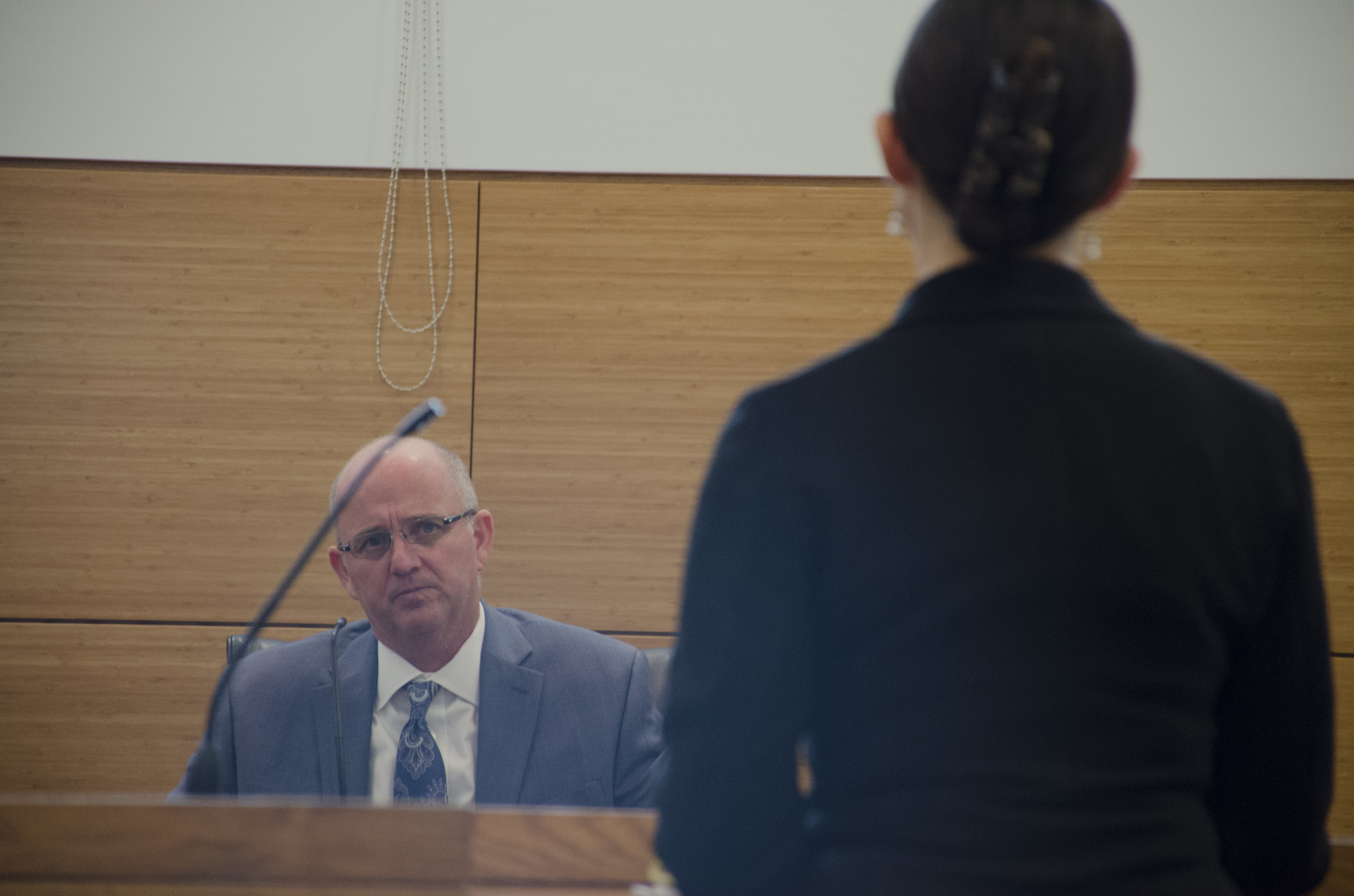 Longboat Police Detective Lieutenant Robert Bourque testifies to questions from council representing the department , Regina Kardash.