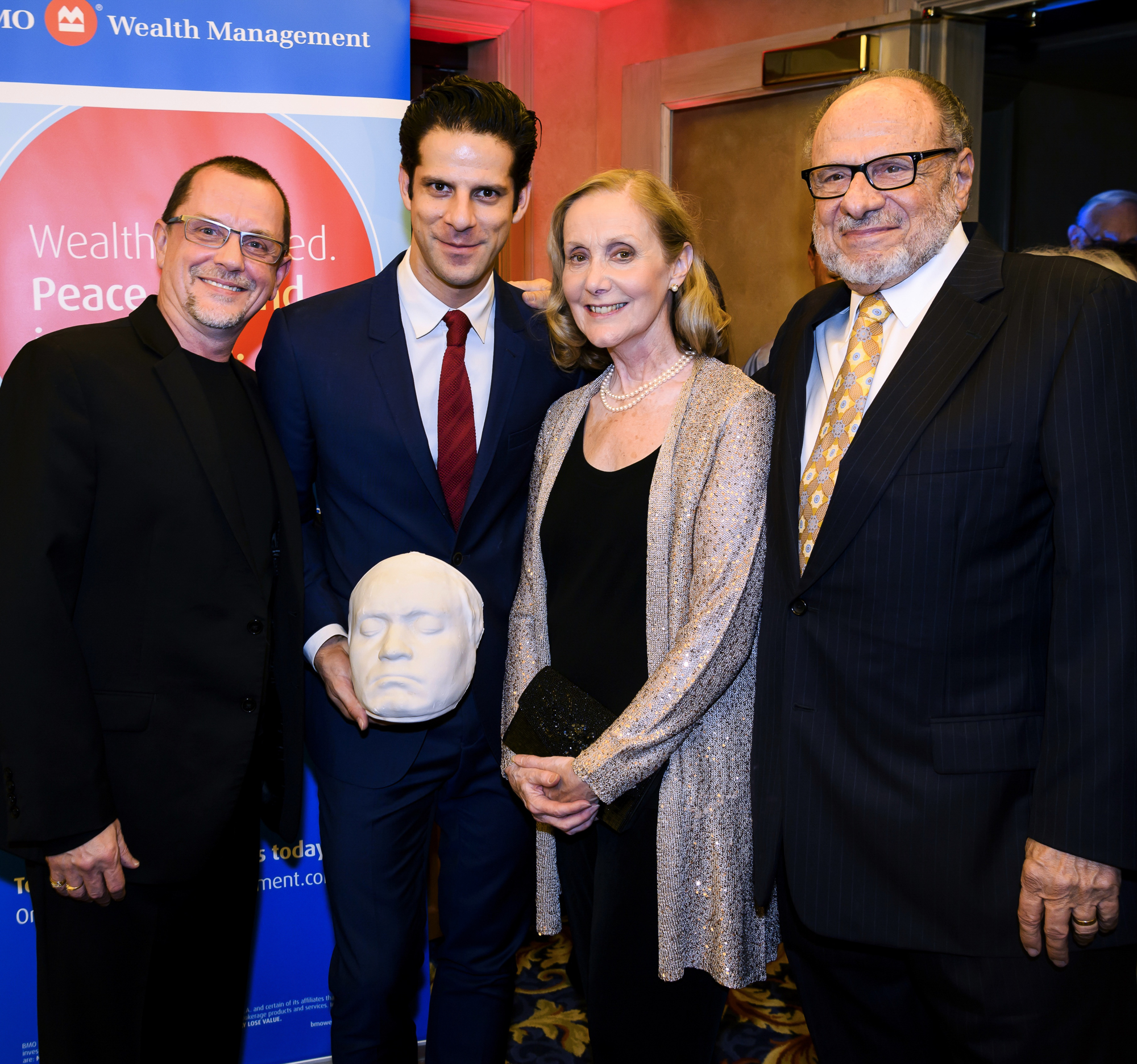 Sarasota Ballet Director Iain Webb, guest choreographer Marcelo Gomes, Assistant Director Margaret Barbieri and Executive Director Joe Volpe pose with Gomes' gift. Photo by Cliff Roles  