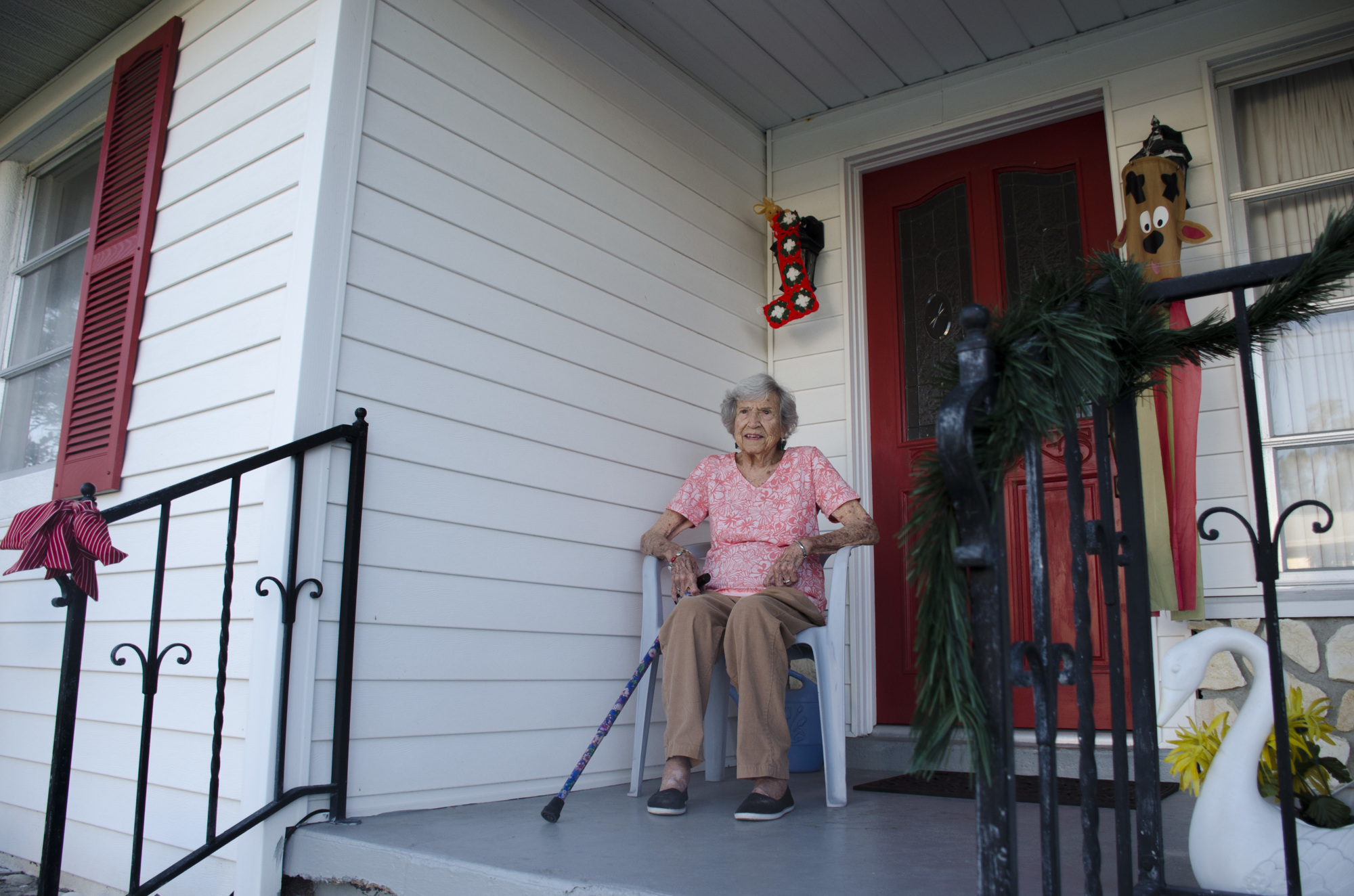 Shirley Beachum, 96, on the front porch of the house her father, Jim Johnson, built 64 years ago.