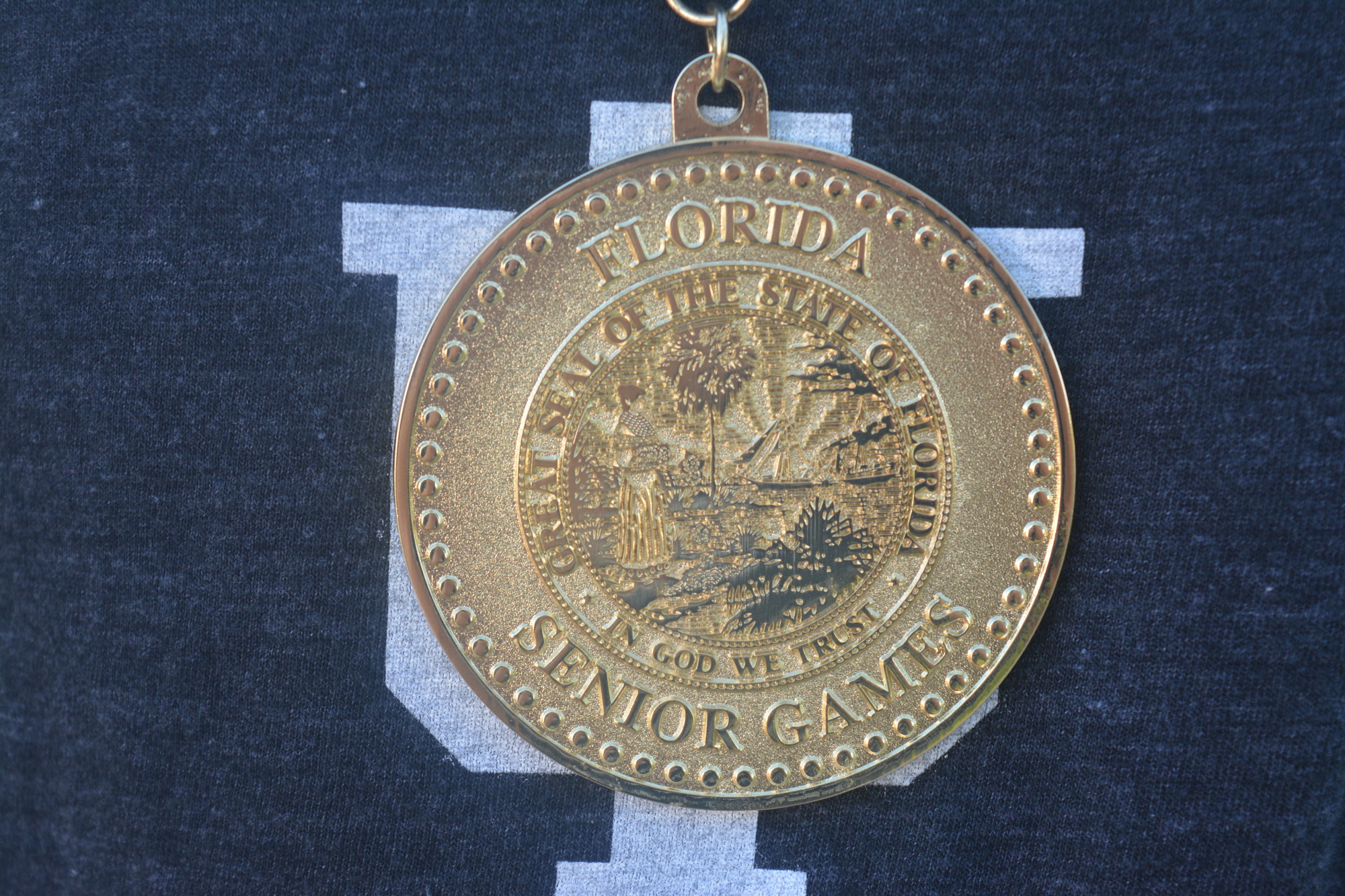 A close-up of Stan Edelson's Florida Senior Games gold medal.