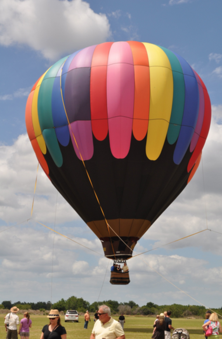 One of the hot air balloons was tethered and lifted off the ground during the 2013 Sip and Soar event. It was the last festival to feature hot air balloons held at the Premier Sports Campus.