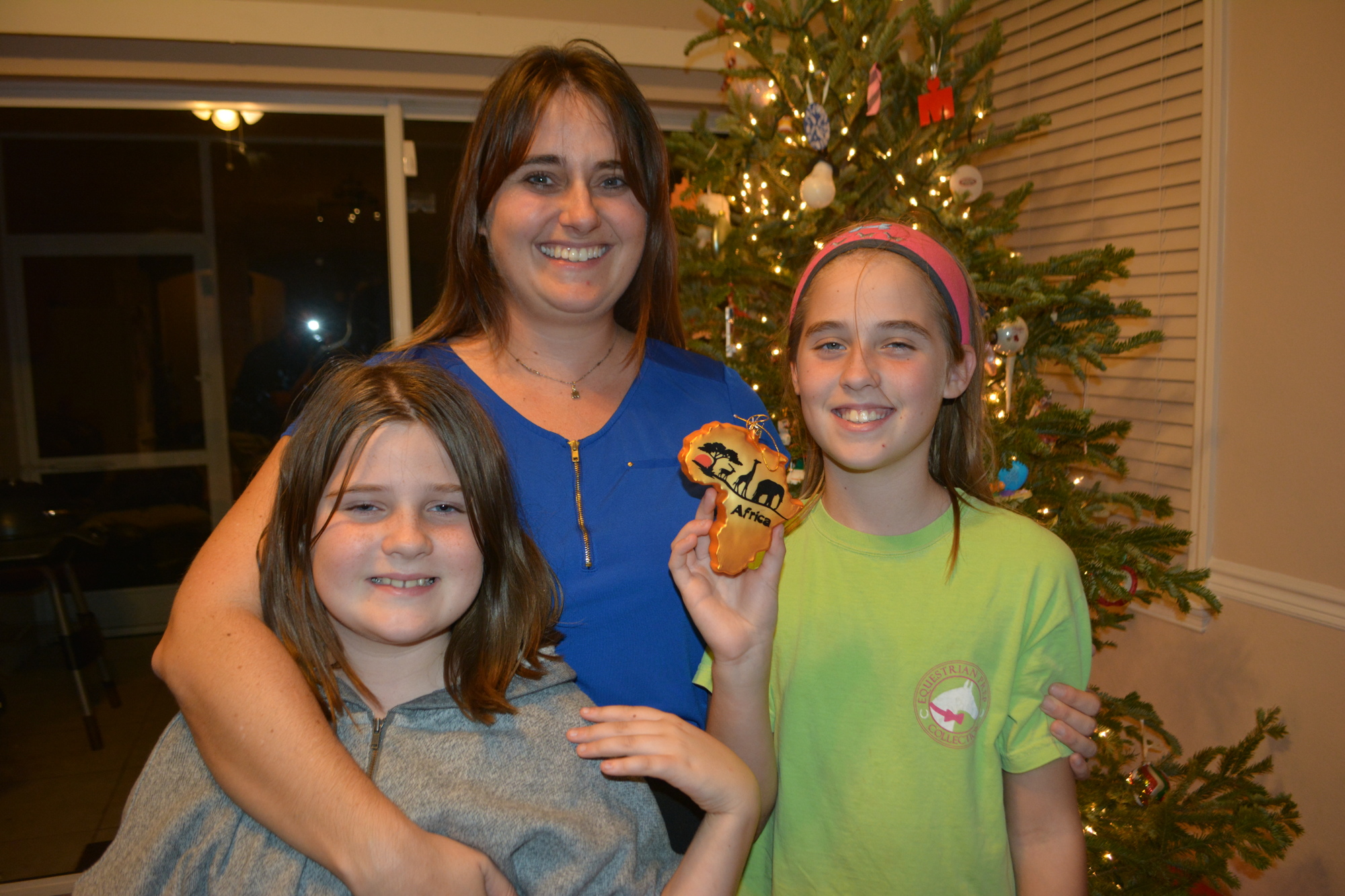 Greenbrook's Hailey, Rachel and Audrey Weeks show off their ornament from Africa.