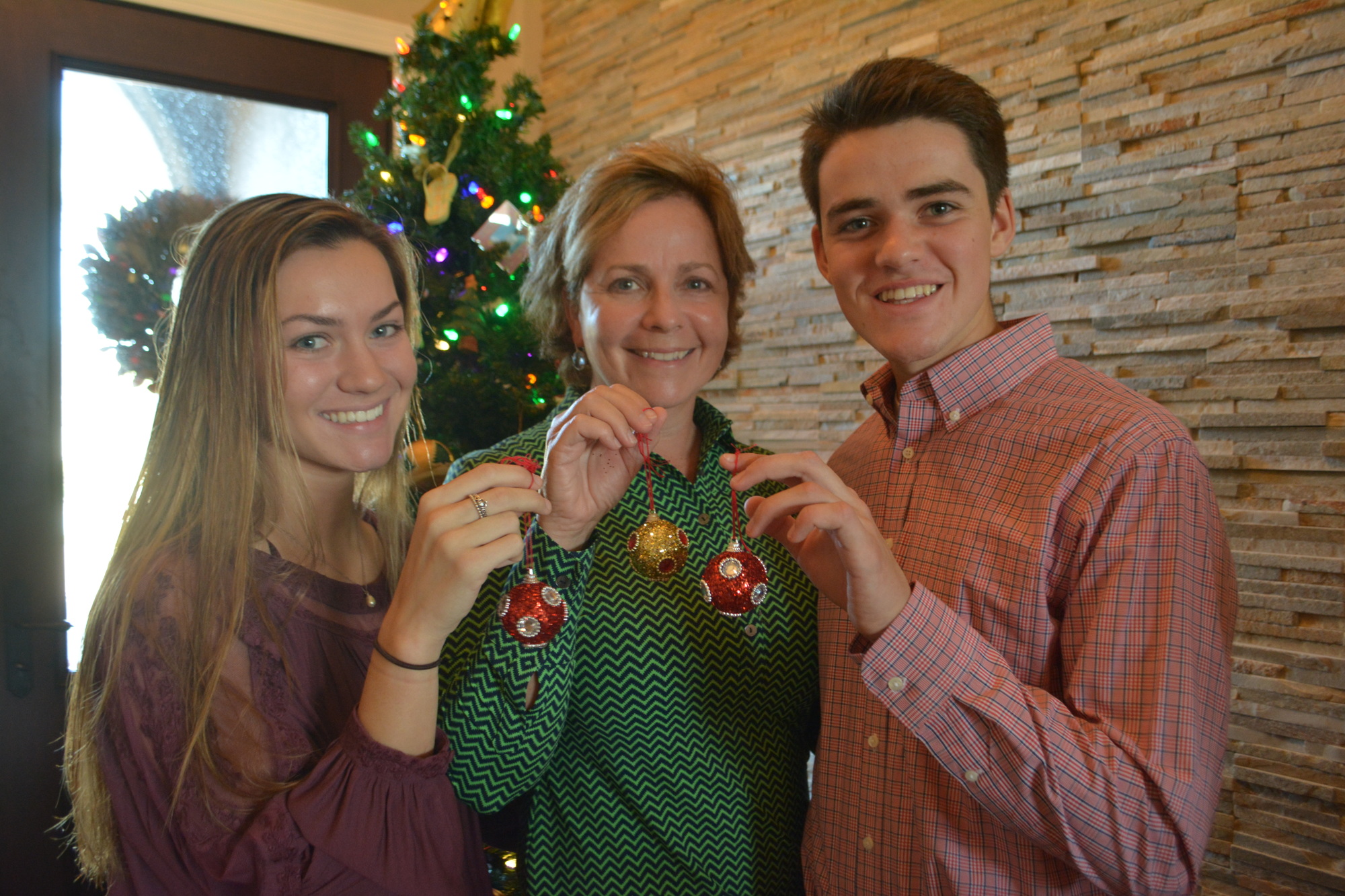 Lake Club's Caroline Diesel, Brook Diesel-Veith and Will Diesel show off ornaments that have special meaning to them.