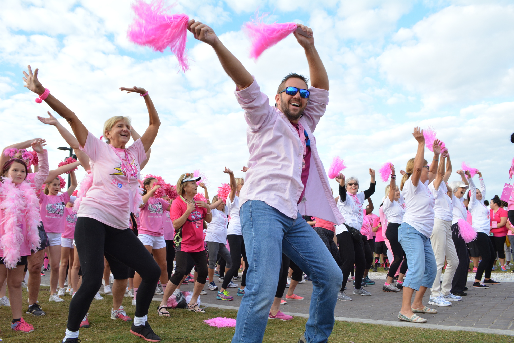 Jeff Golomb leads a flash mob for Team I Am Pink during the 2017 Making Strides Against Breast Cancer.  He and his girlfriend, Rachel Hagoune, a survivor, have been doing the flash mob for three years.