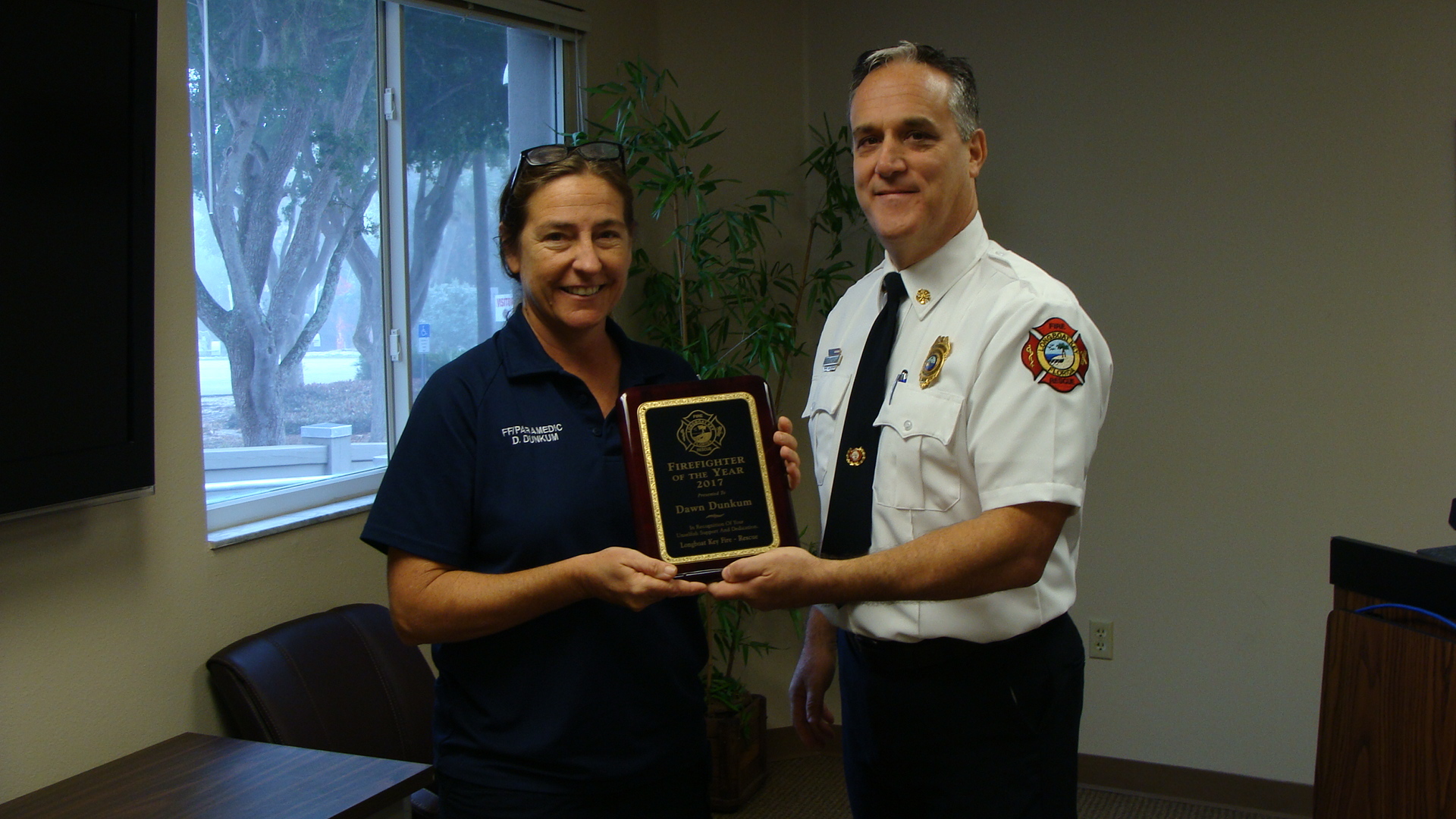 Chief Dezzi presents Dawn Dunkum with the  Firefighter of the Year Award.  Courtesy photo