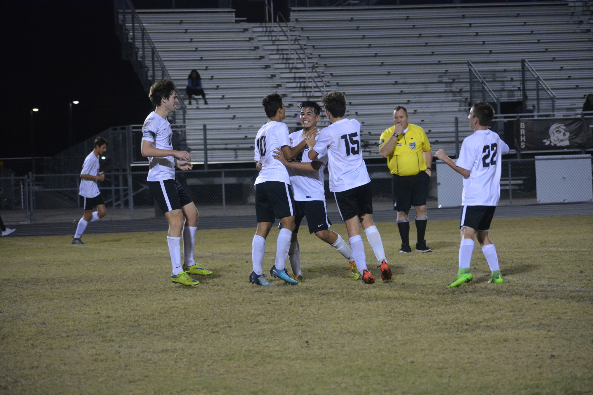 Senior Aystin Martinez (24) is mobbed by teammates after his second-half goal.