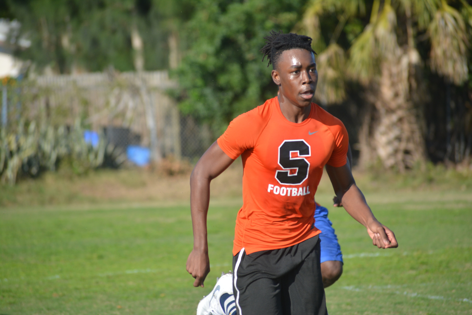 Simeon Waters takes off during sprints. New Sarasota High coach Spencer Hodges tested his team's athleticism on his first day.