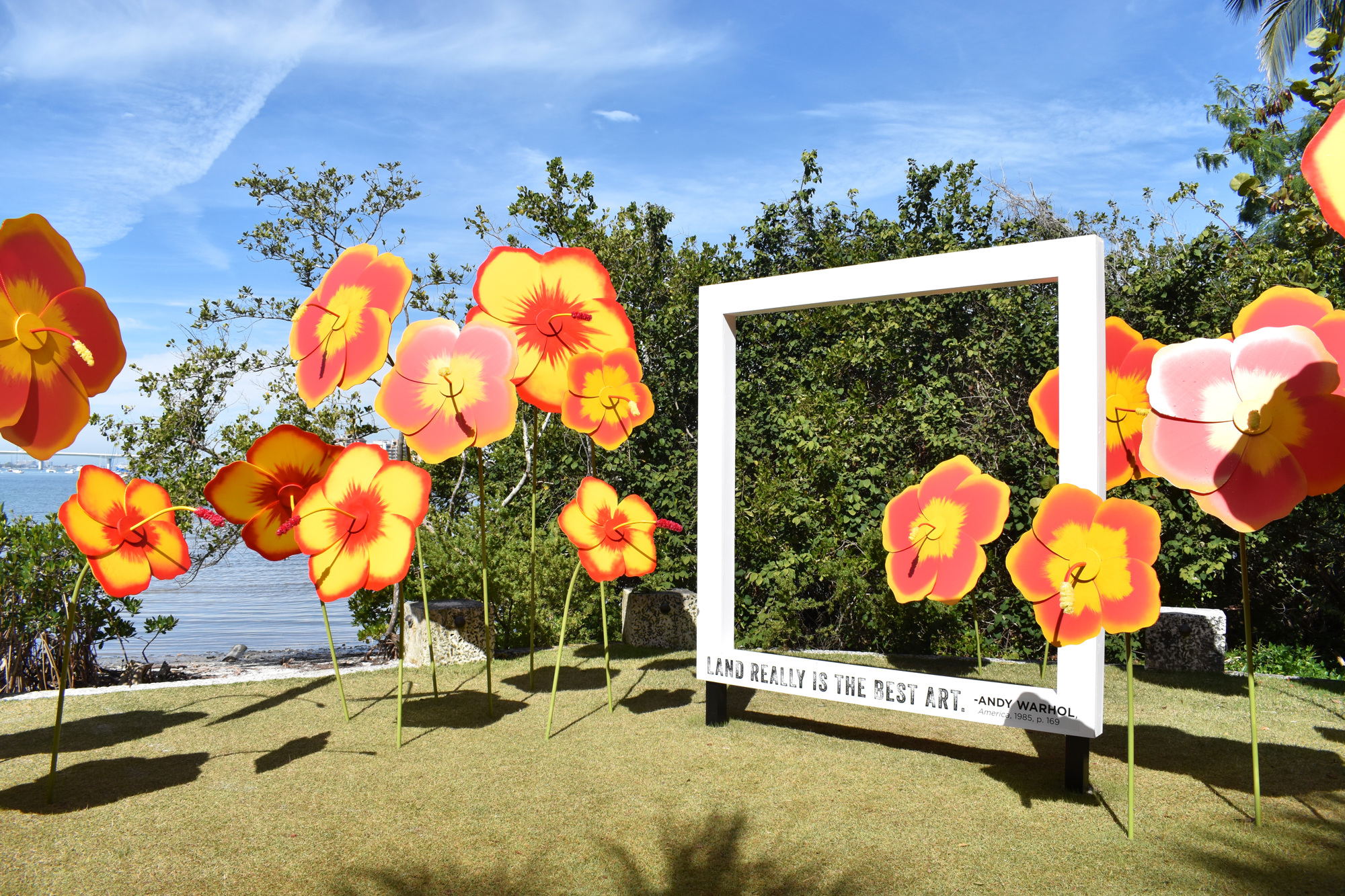 Oversize, fabricated hibiscus flowers provide a colorful, waterfront scene that celebrates nature as art. Photo by Niki Kottmann