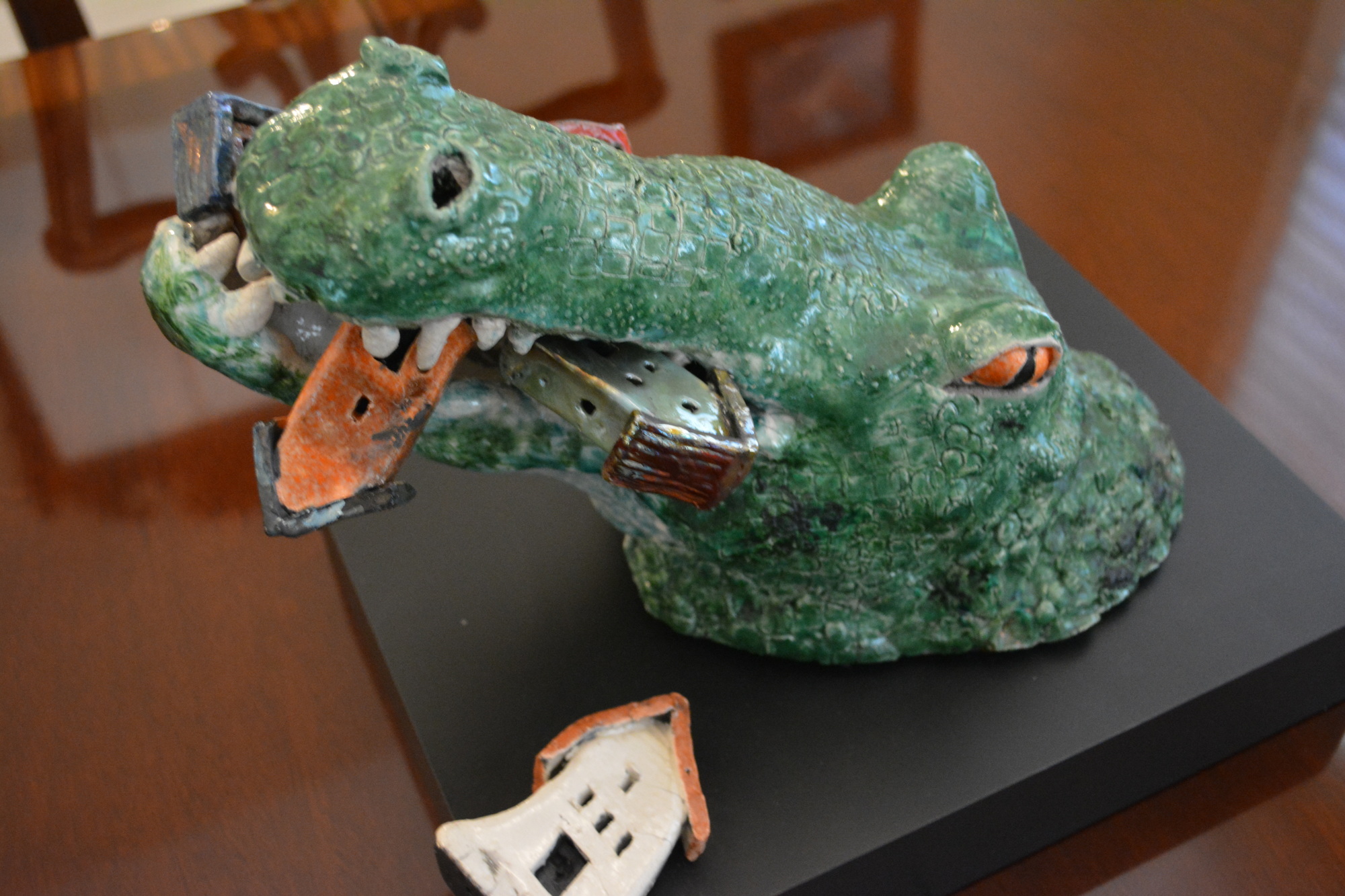 This alligator was made following Hurricane Irma and was meant to portray the hurricane, with houses being crushed in the alligator's mouth.