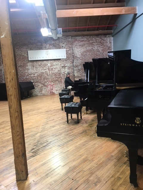 Principal Keyboard Jonathan Spivey tests pianos in Los Angeles. Courtesy photo