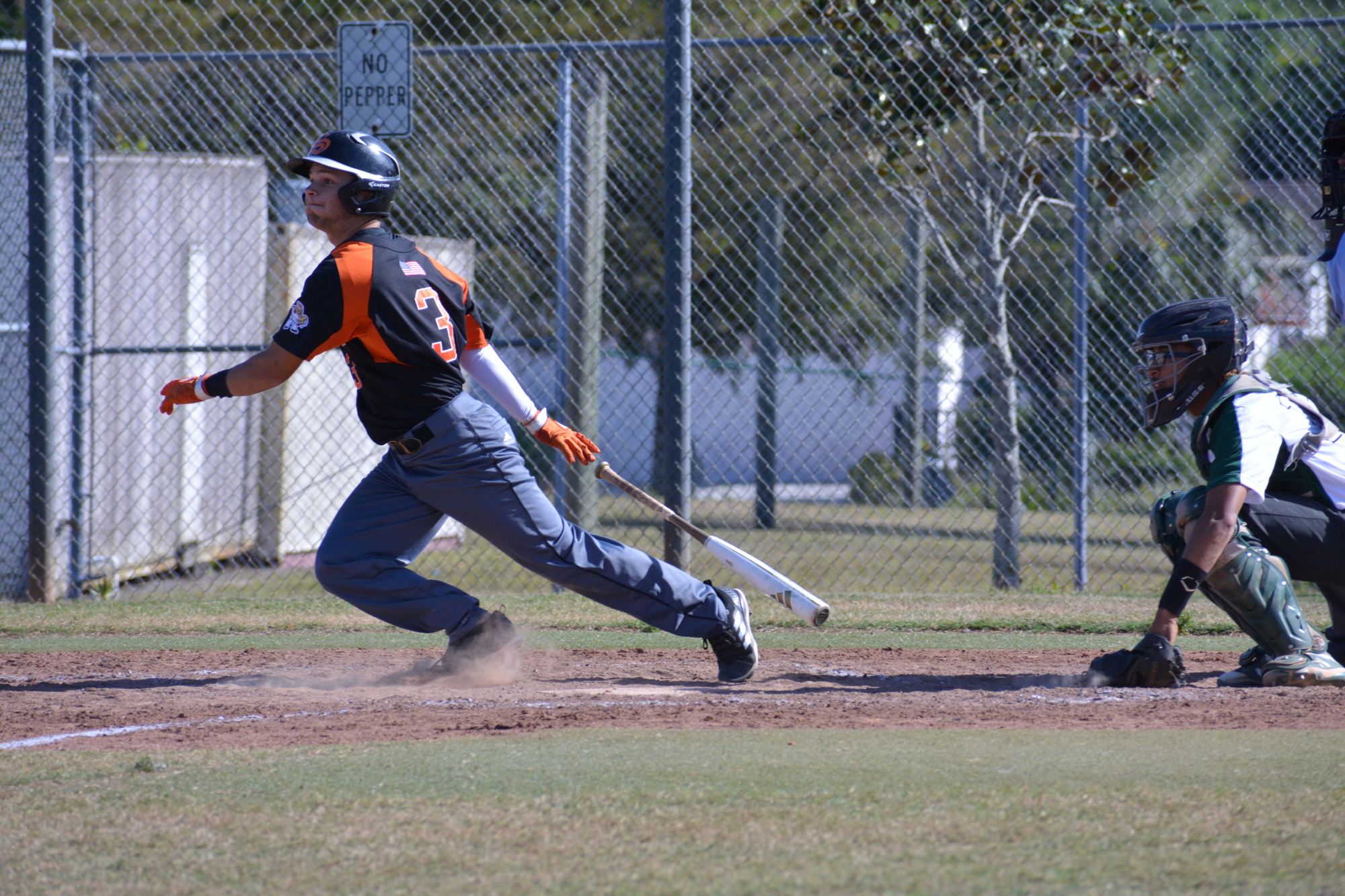 Sarasota High shortstop Nick Winkelmeyer slices a ball to the outfield against Saint Petersburg.