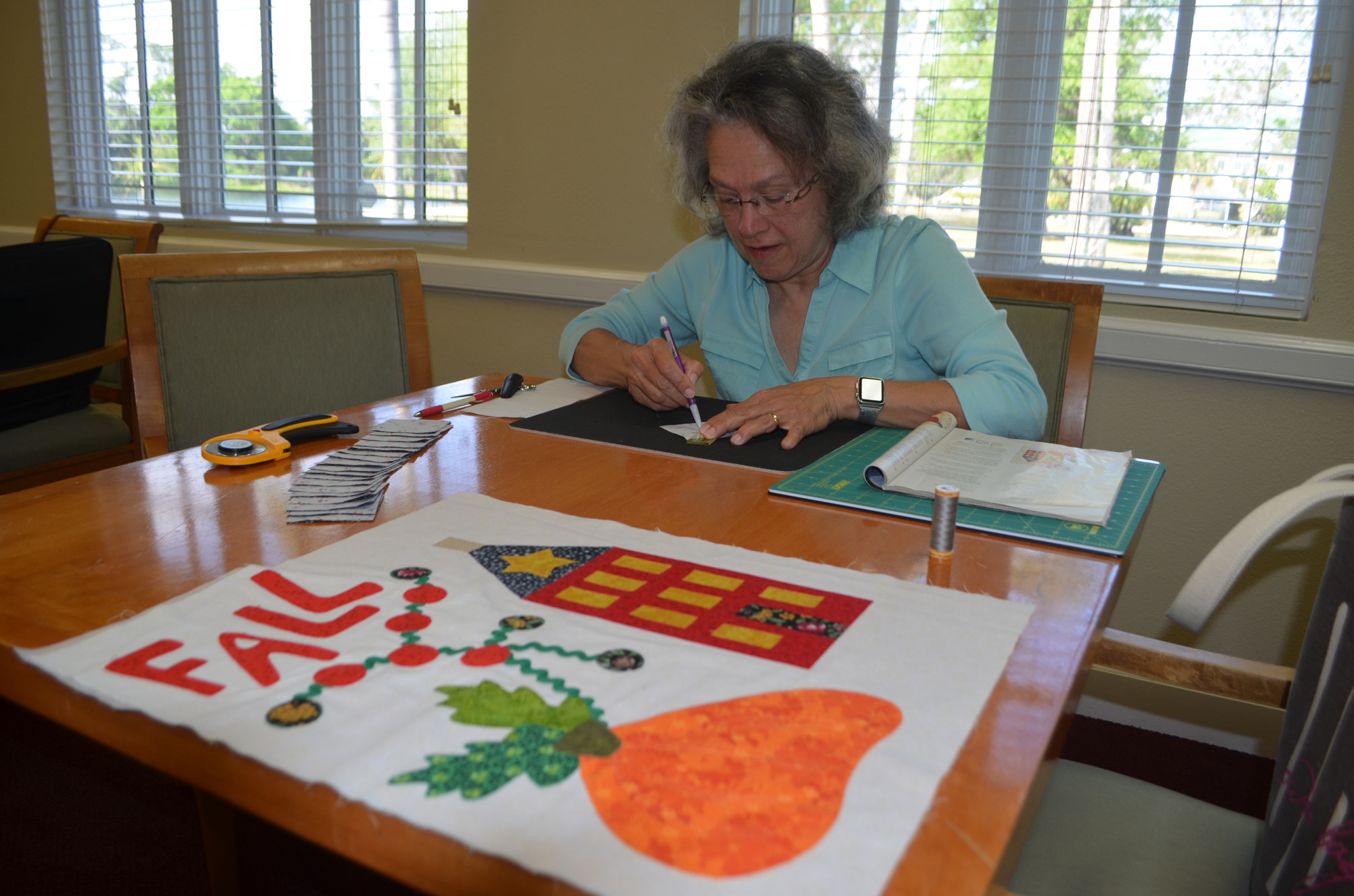 Mary Jane Diaz may be a beginner, but she already knows how to measure out and carefully create her quilt.