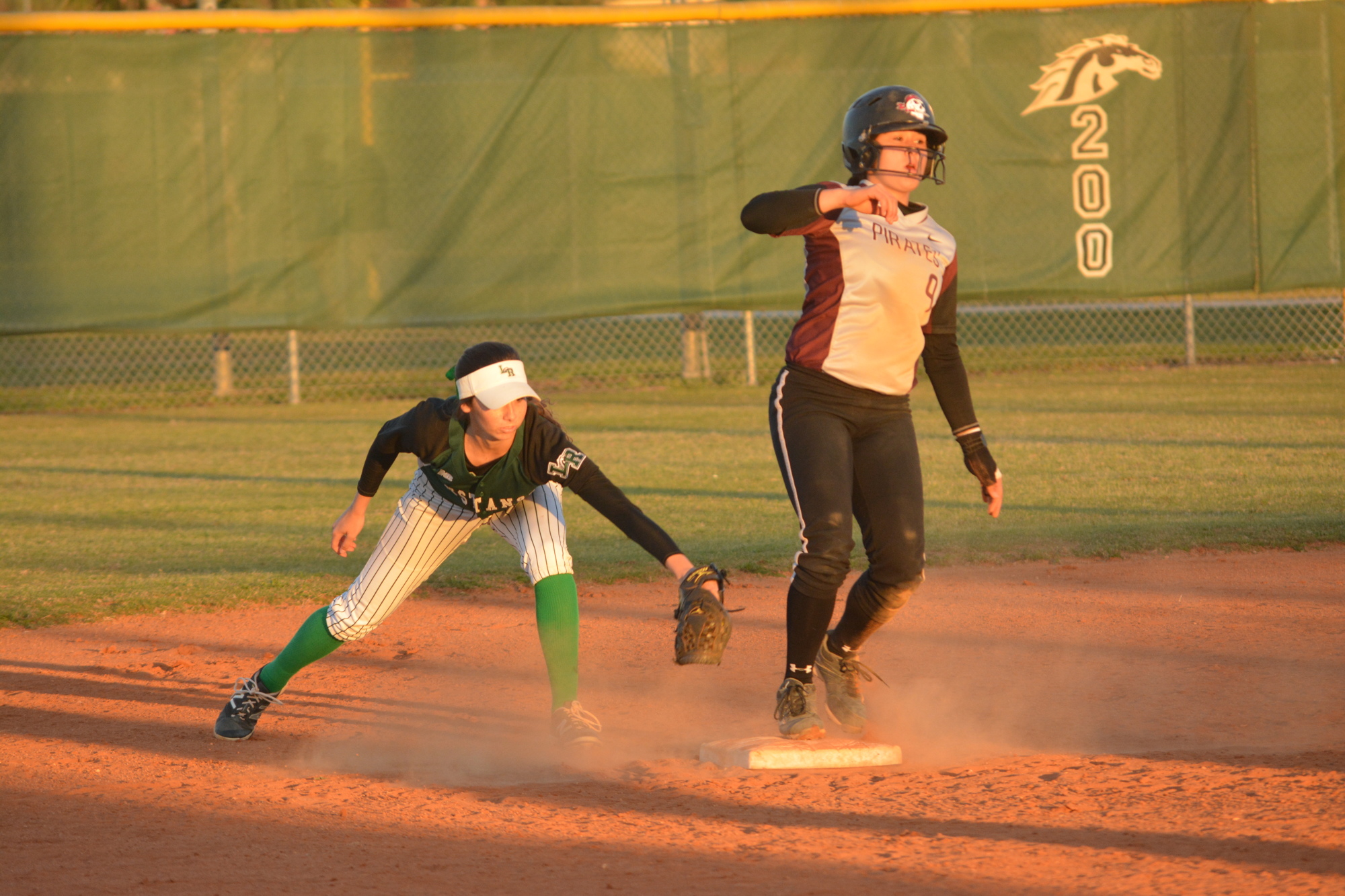 Lakewood Ranch's Denali Schappacher, now at UCF, tags Braden River's Myah Moy, who now plays at Rutgers University. Moy committed as a sophomore.