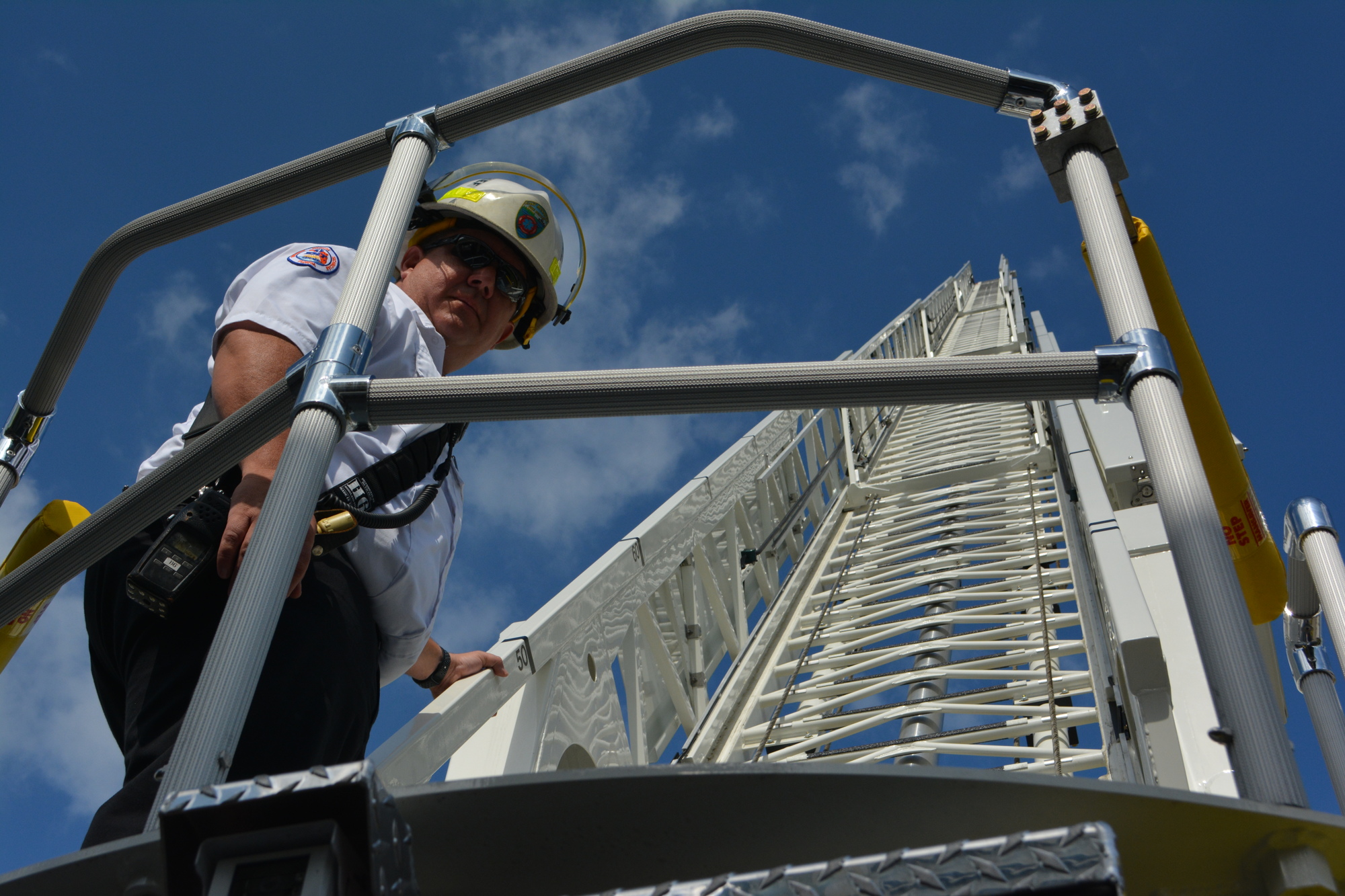 Battalion Chief Derrick Toney extends the aerial truck's ladder.