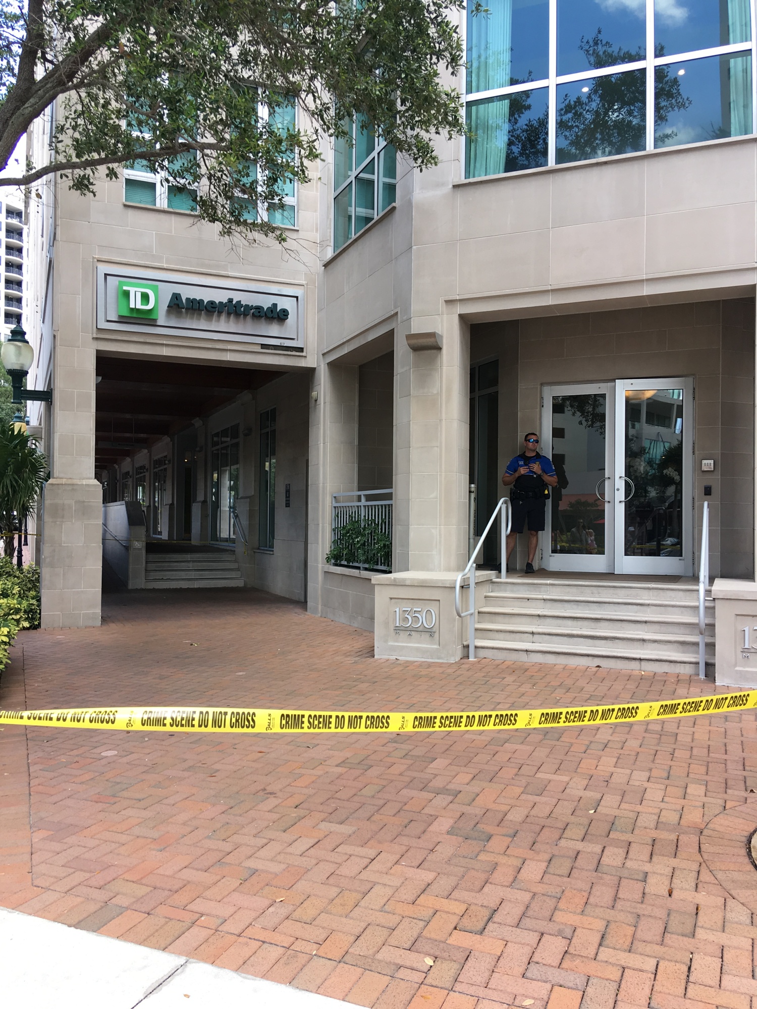 The police taped off the entrance to 1350 Main this afternoon while investigating the shooting.