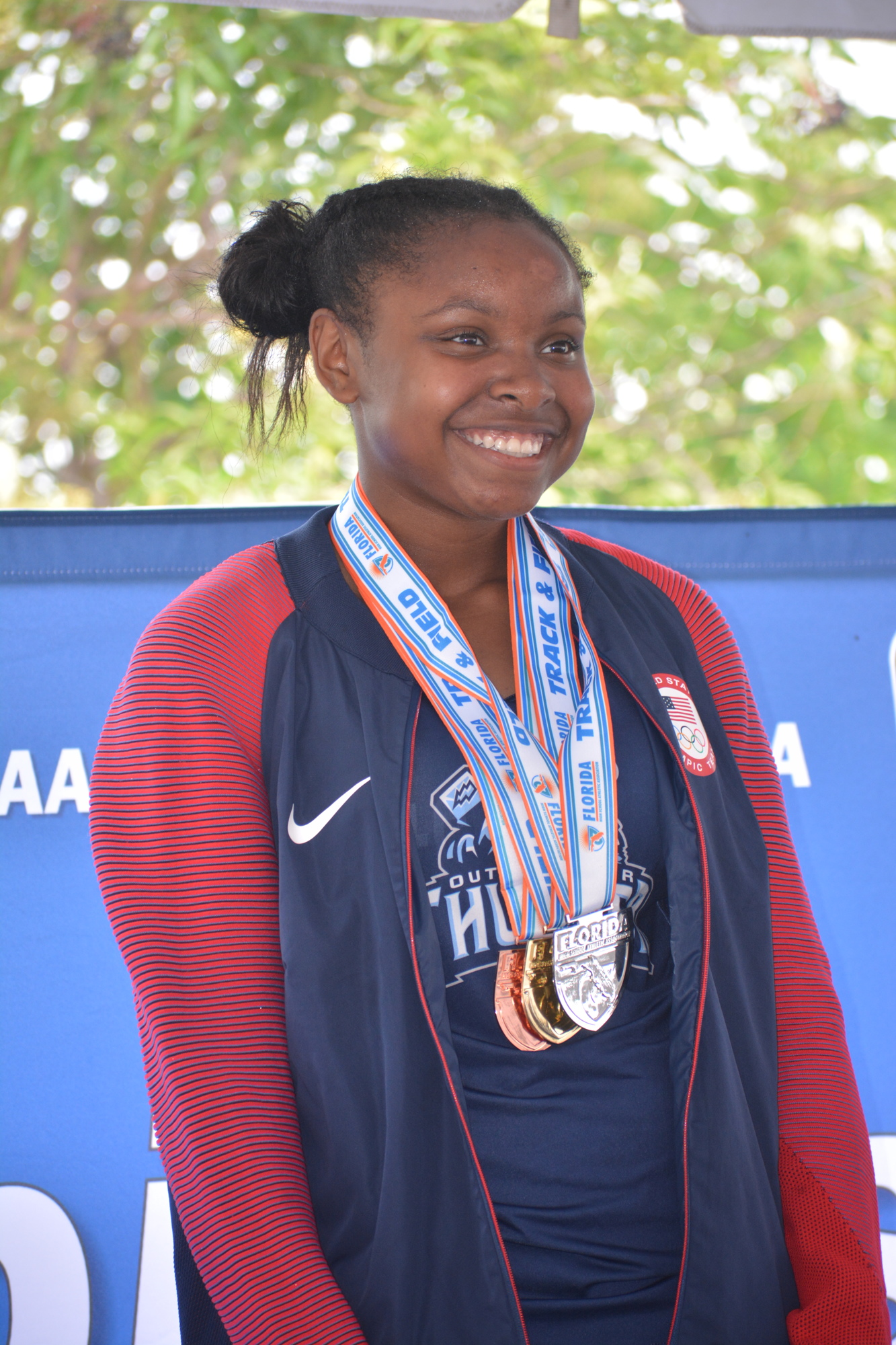 ODA freshman Saraiah Walkes relishes her gold, silver and bronze medals over a 2020 Olympics jacket.