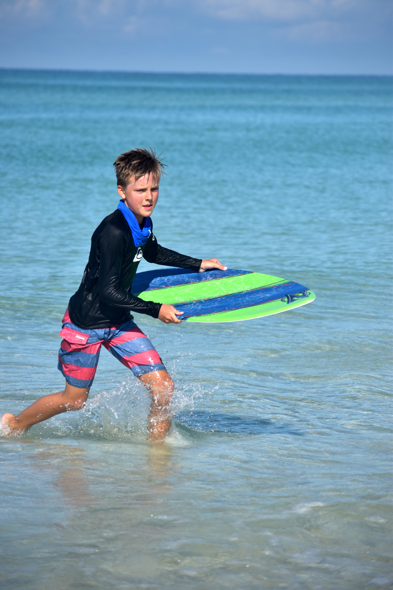 Max Freeman catches a wave during a 2017 Sarasota County camp.