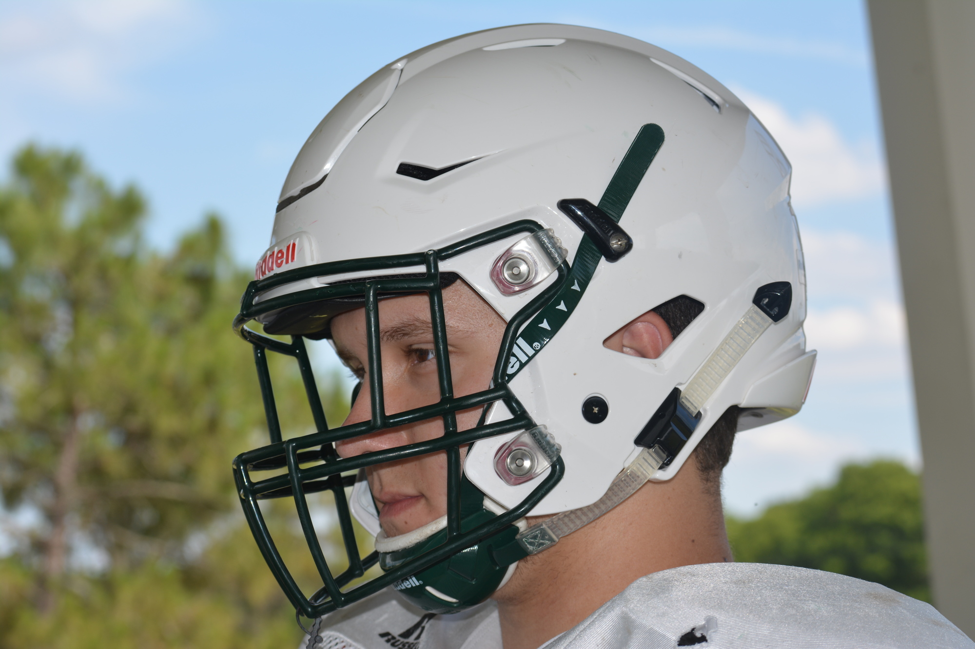Lakewood Ranch center John Riley models the new helmets.