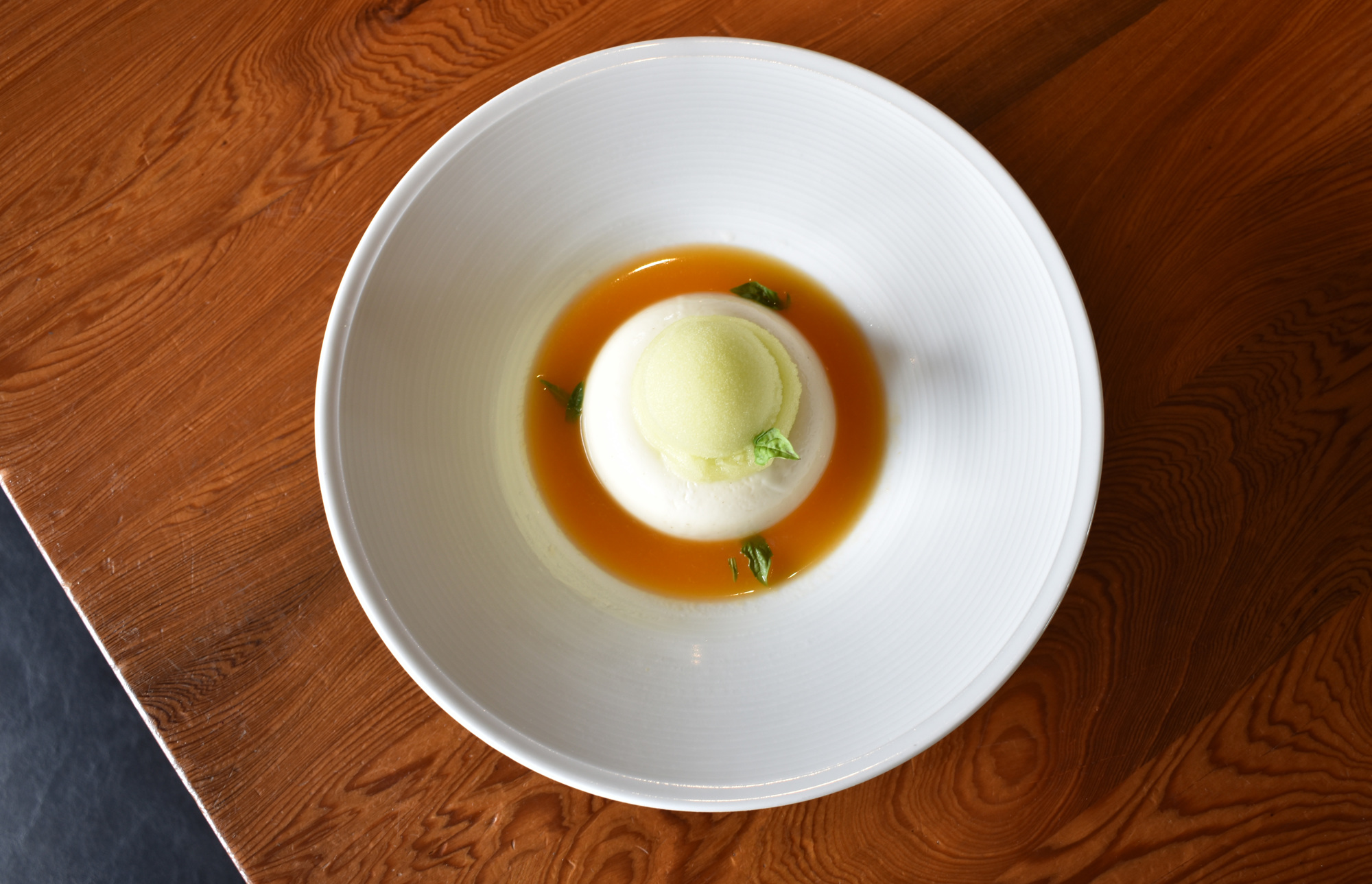 The French lavender-scented buttermilk panna cotta on Shore's Savor Sarasota Restaurant Week menu features moscato d'asti apricot coup and green apple sorbet. Photo by Niki Kottmann