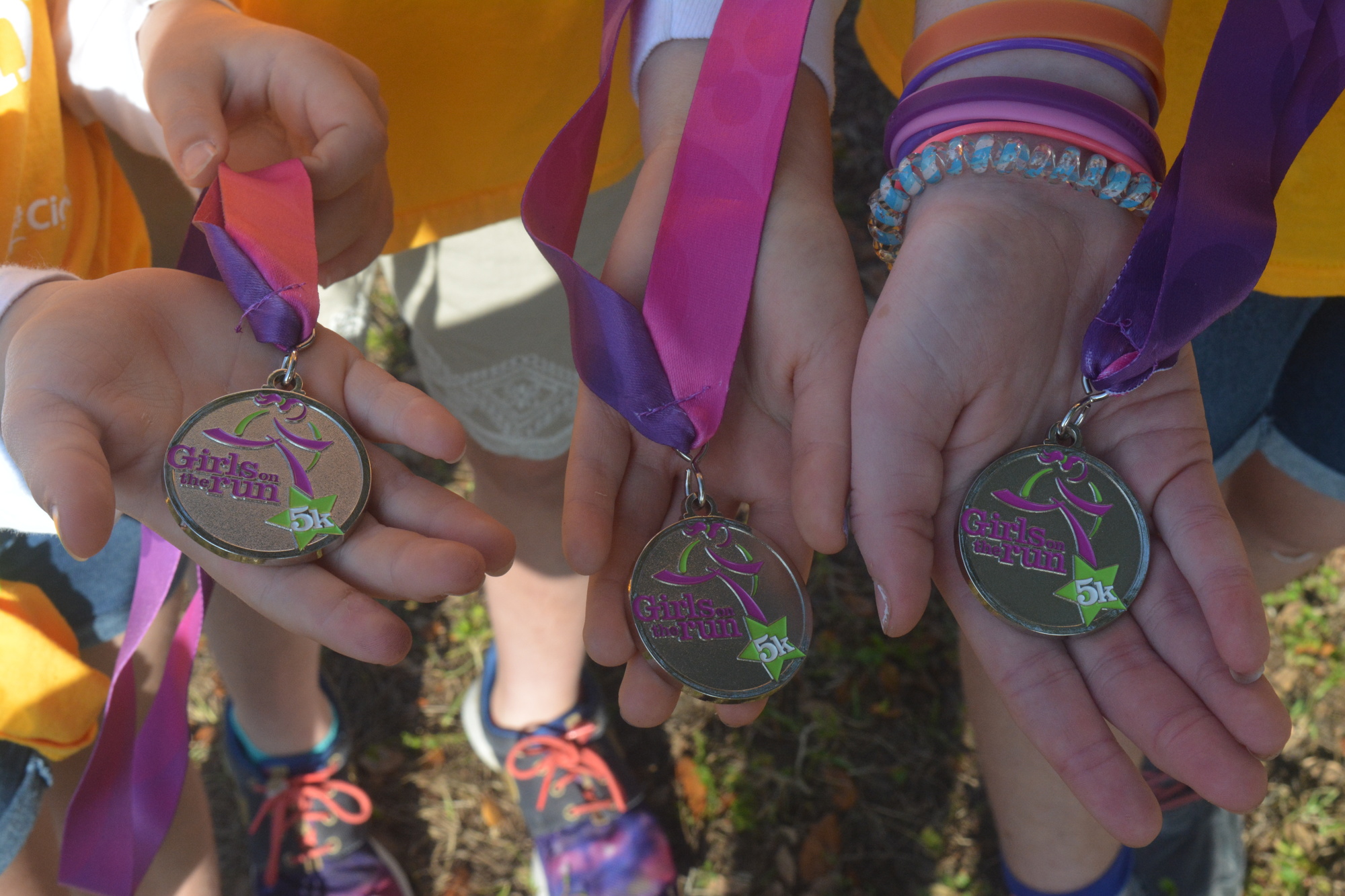 Medals awarded to the participants of the Girls on the Run 5K presented by UnitedHealthcare.