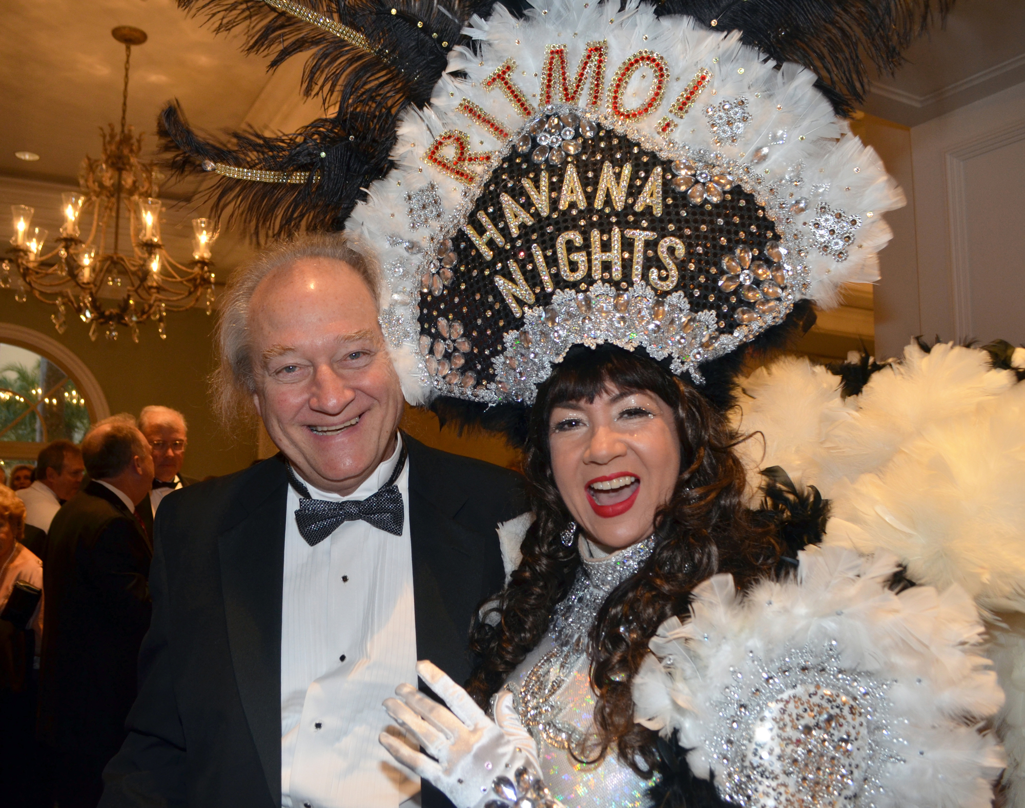 Gary Sweetman poses with a cabaret dancer at the Asolo Repertory Theatre Gala: “Cabaret at the Tropicana” on Saturday, March 5, at The Ritz-Carlton, Sarasota. Photo by Heather Merriman Saba