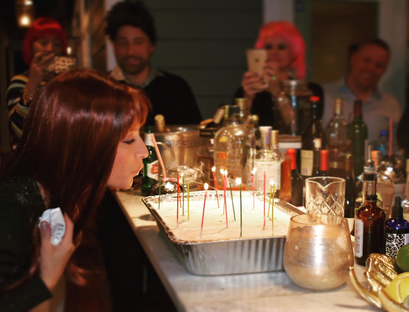 Emily Stroud blows out the candles at her 30th birthday party Dec. 30. Photo courtesy of Kelsey Alholm