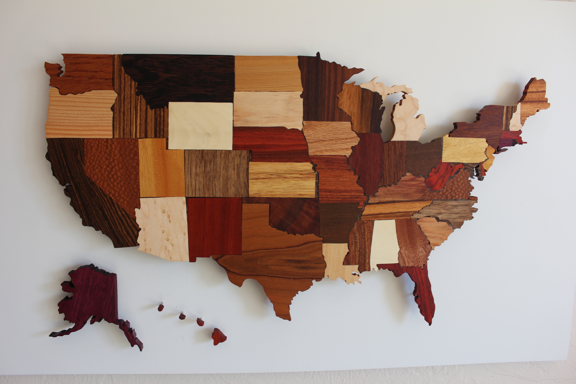 This wall-art piece uses woods native to each state.
