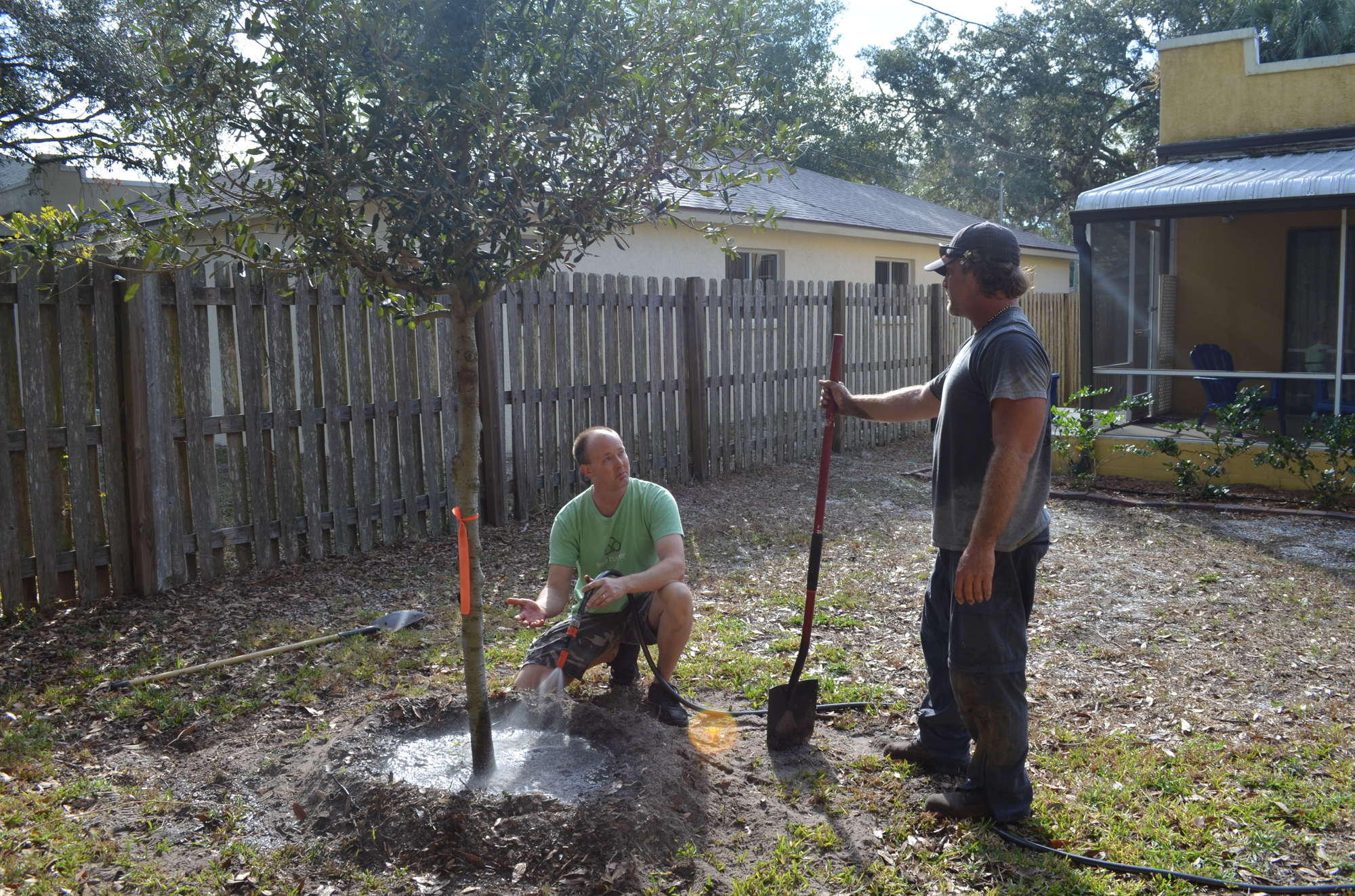 Arlington Park resident Nathan Wilson volunteered to help plant a tree on a neighboring property to mitigate the impacts of development.